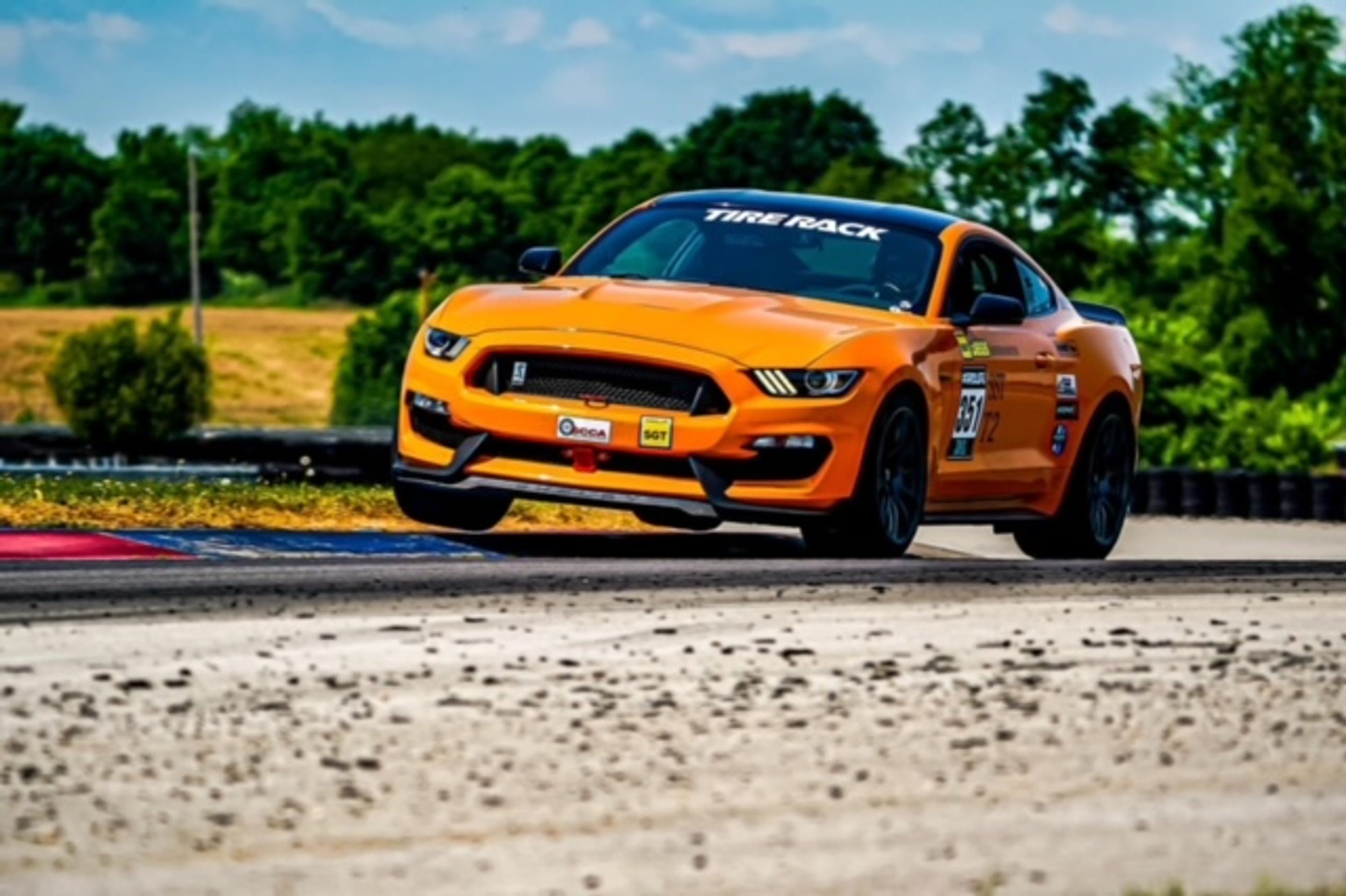 Orange Ford S550 Mustang GT350 with 19" SM-10 Apex wheels in Anthracite