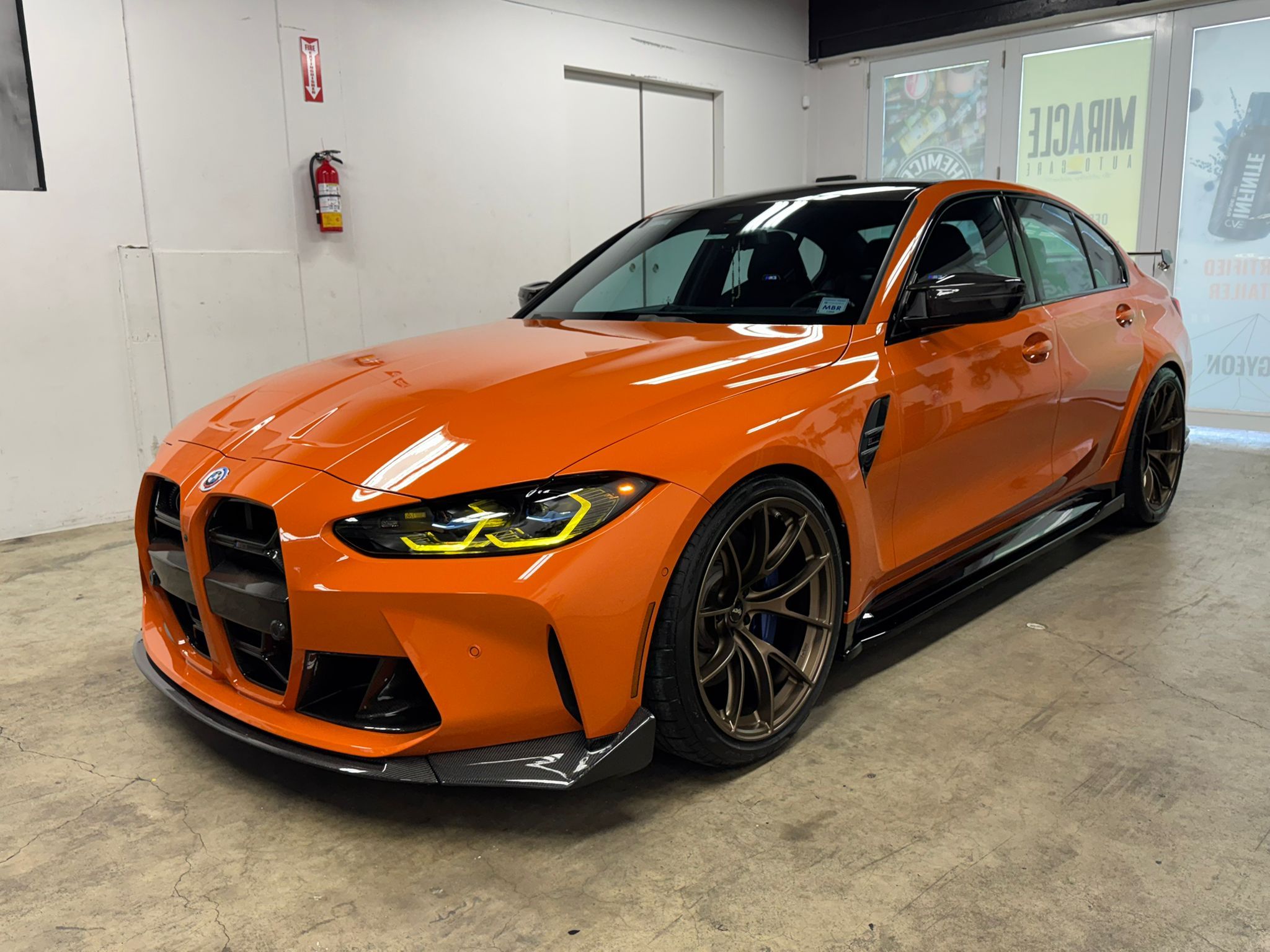 Orange BMW G80 M3 with 20" VS-5RS Apex wheels in Satin Bronze