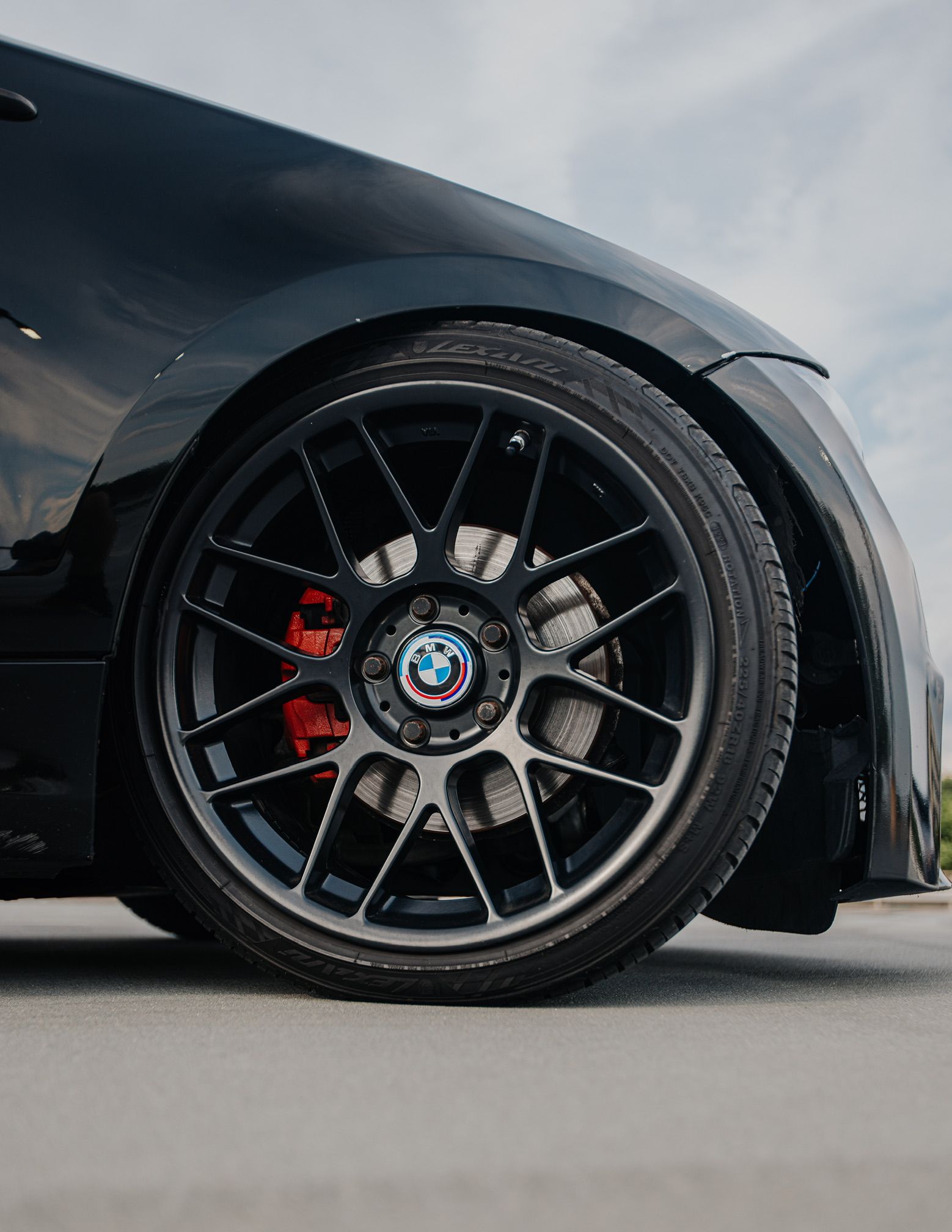 Black BMW E82 1M with 18" ARC-8 Apex wheels in Satin Black