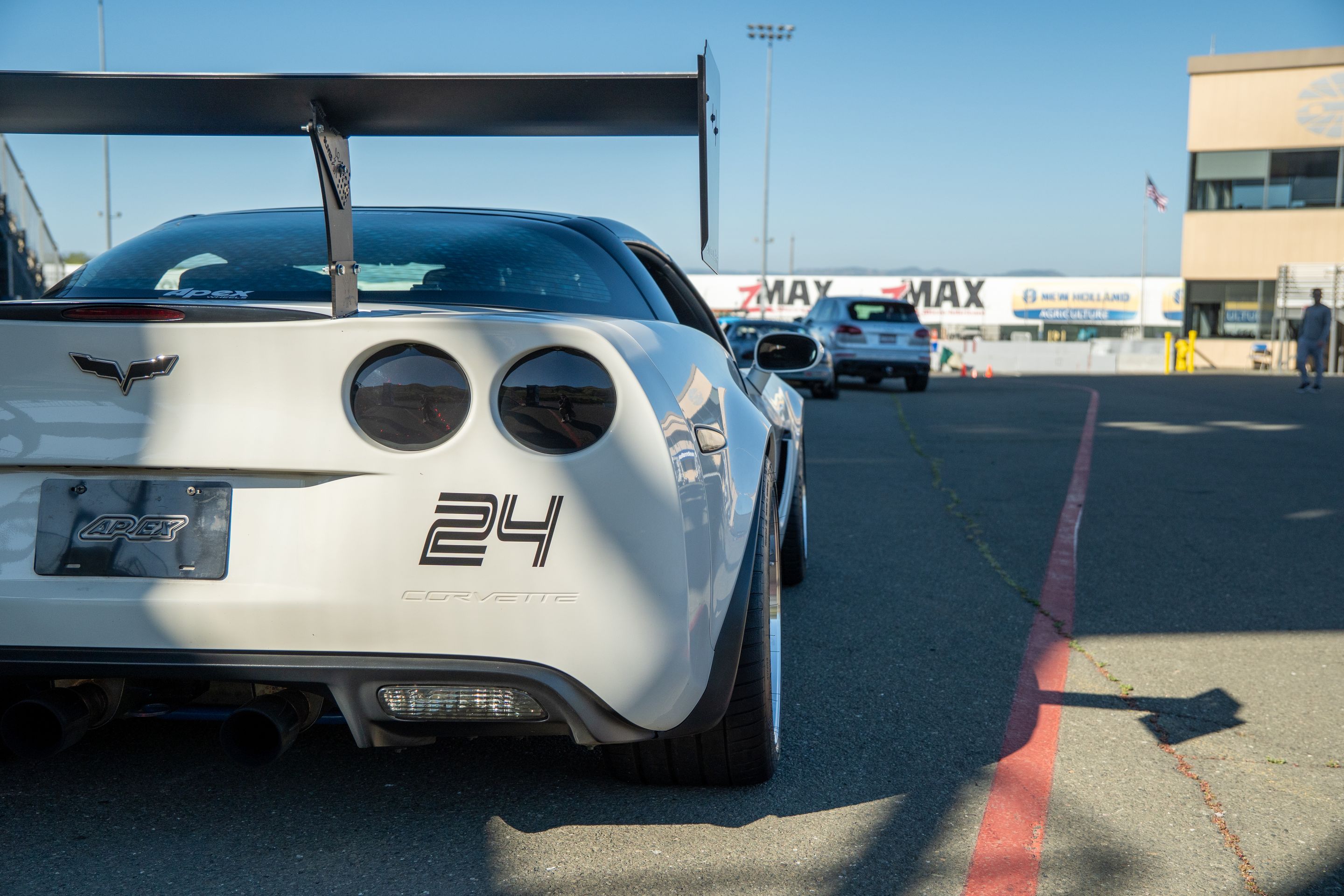 White Chevrolet C6 Corvette Grand Sport with 18"/19" ML-10RT Apex wheels in Machined Lip Race Silver