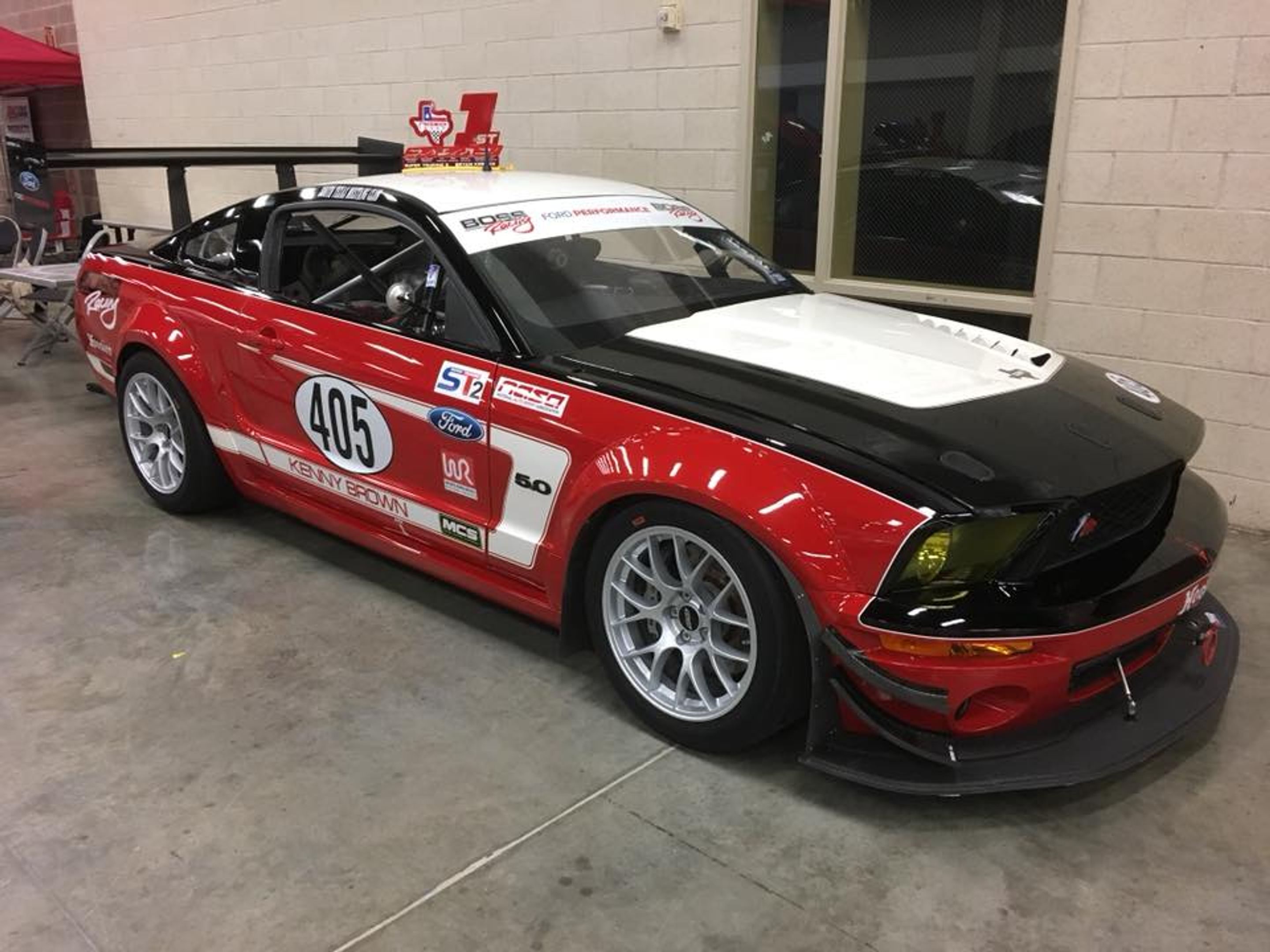 Red Ford S197 Mustang GT with 18" EC-7 Apex wheels in Race Silver