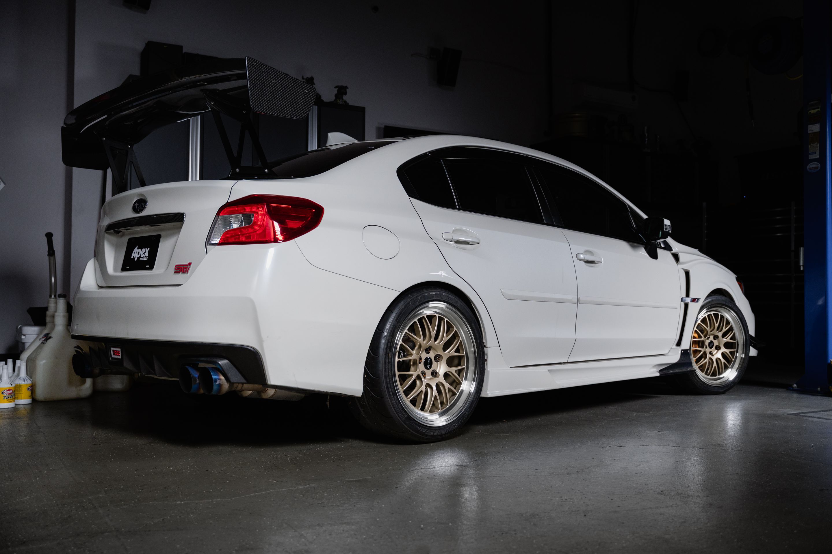 White Subaru VA WRX STI with 18" ML-10RT Apex wheels in Machined Lip Gloss Motorsport Gold