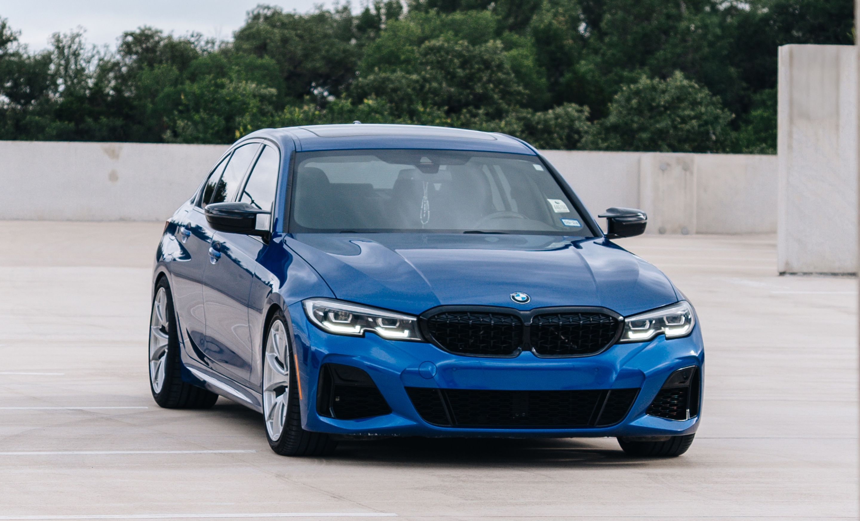 Blue BMW G20 Sedan 3 Series with 19" VS-5 Apex wheels in Race Silver
