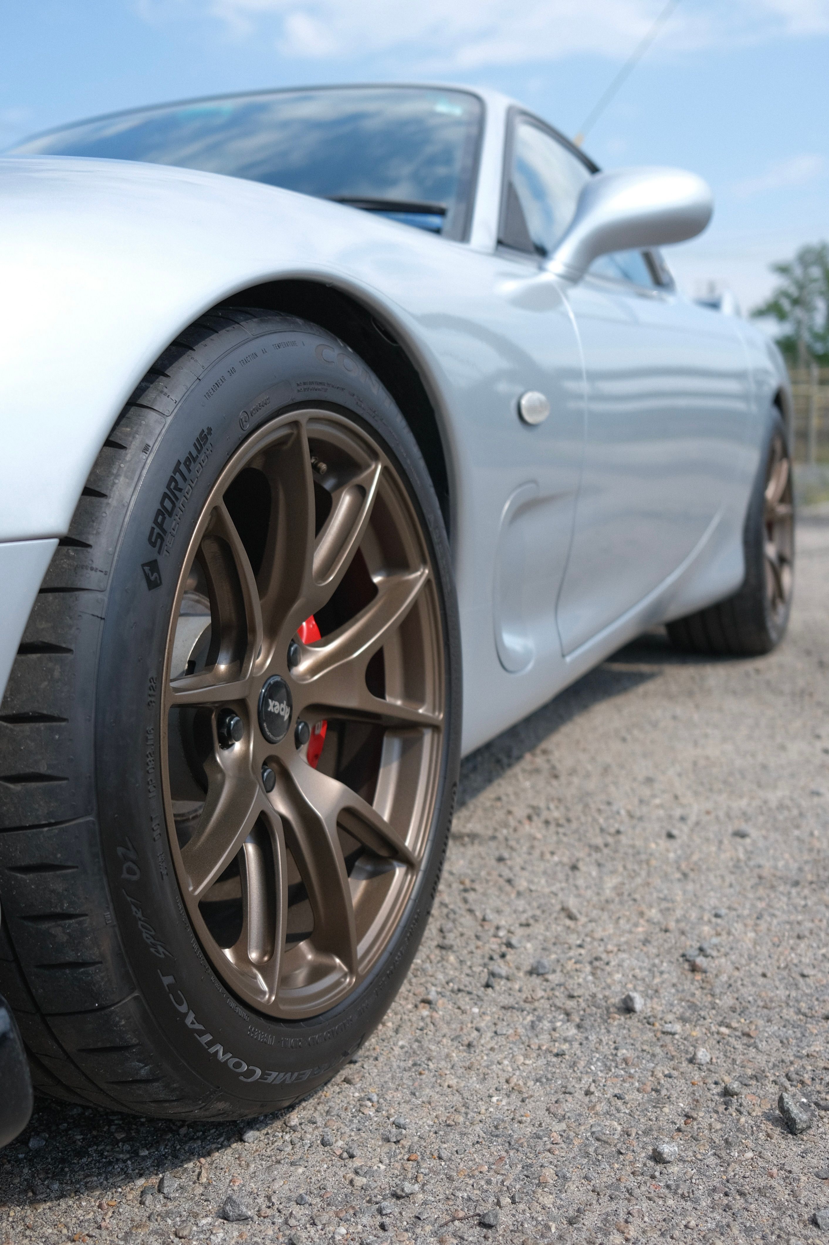Silver Mazda FD RX-7 with 17" VS-5 Apex wheels in Satin Bronze