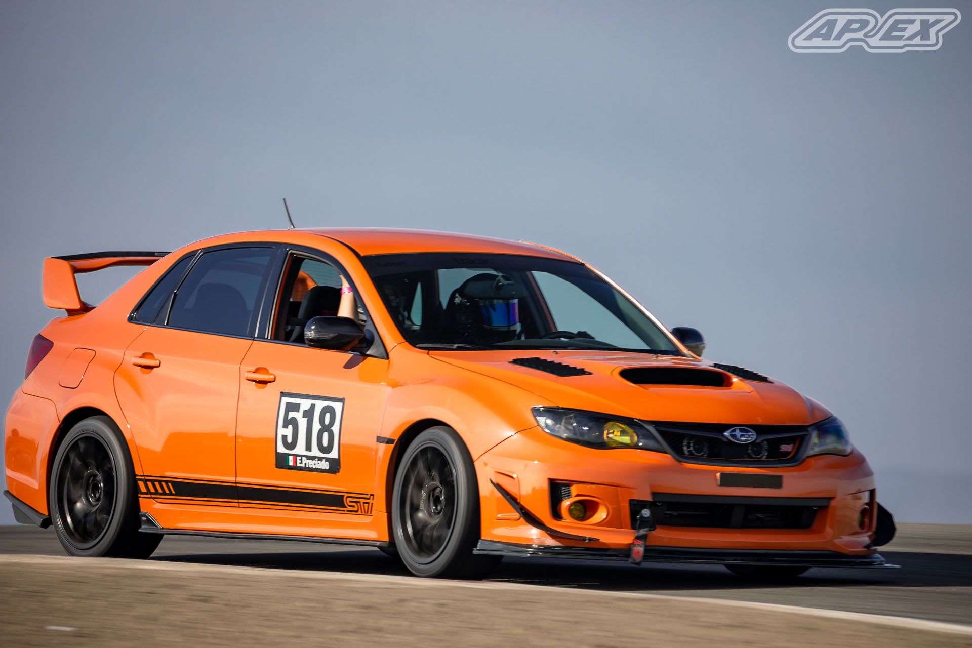 Orange Subaru GR WRX STI with 18" EC-7 Apex wheels in Satin Black