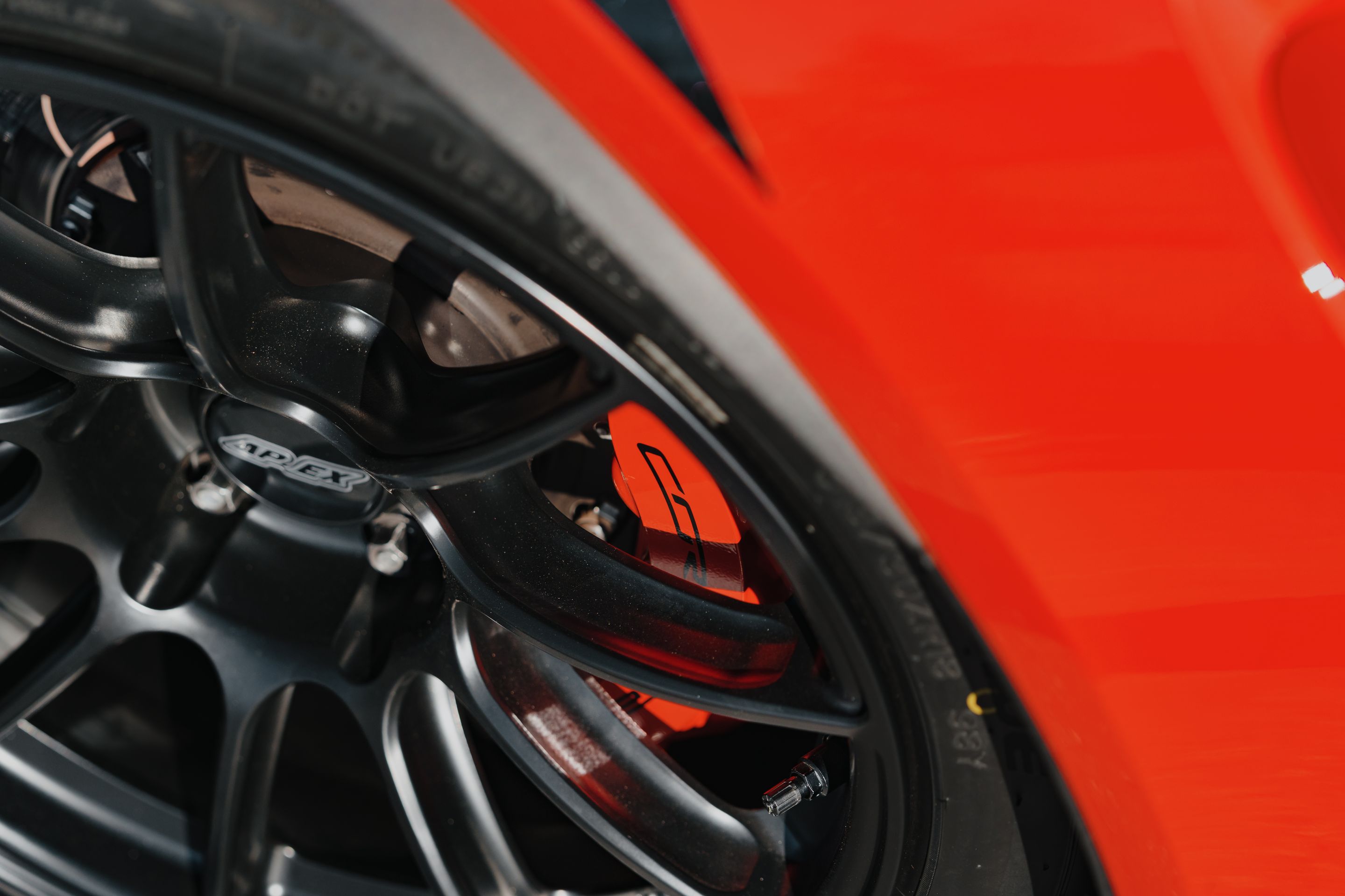 Red Chevrolet C7 Corvette Grand Sport with 18" SM-10RS Apex wheels in Satin Black