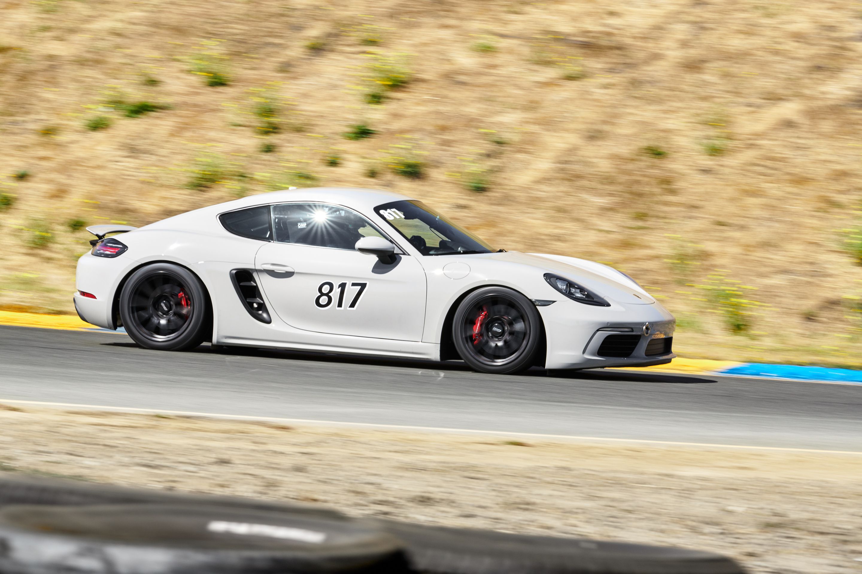 White Porsche 718 Cayman S with 18" SM-10 Apex wheels in Satin Black