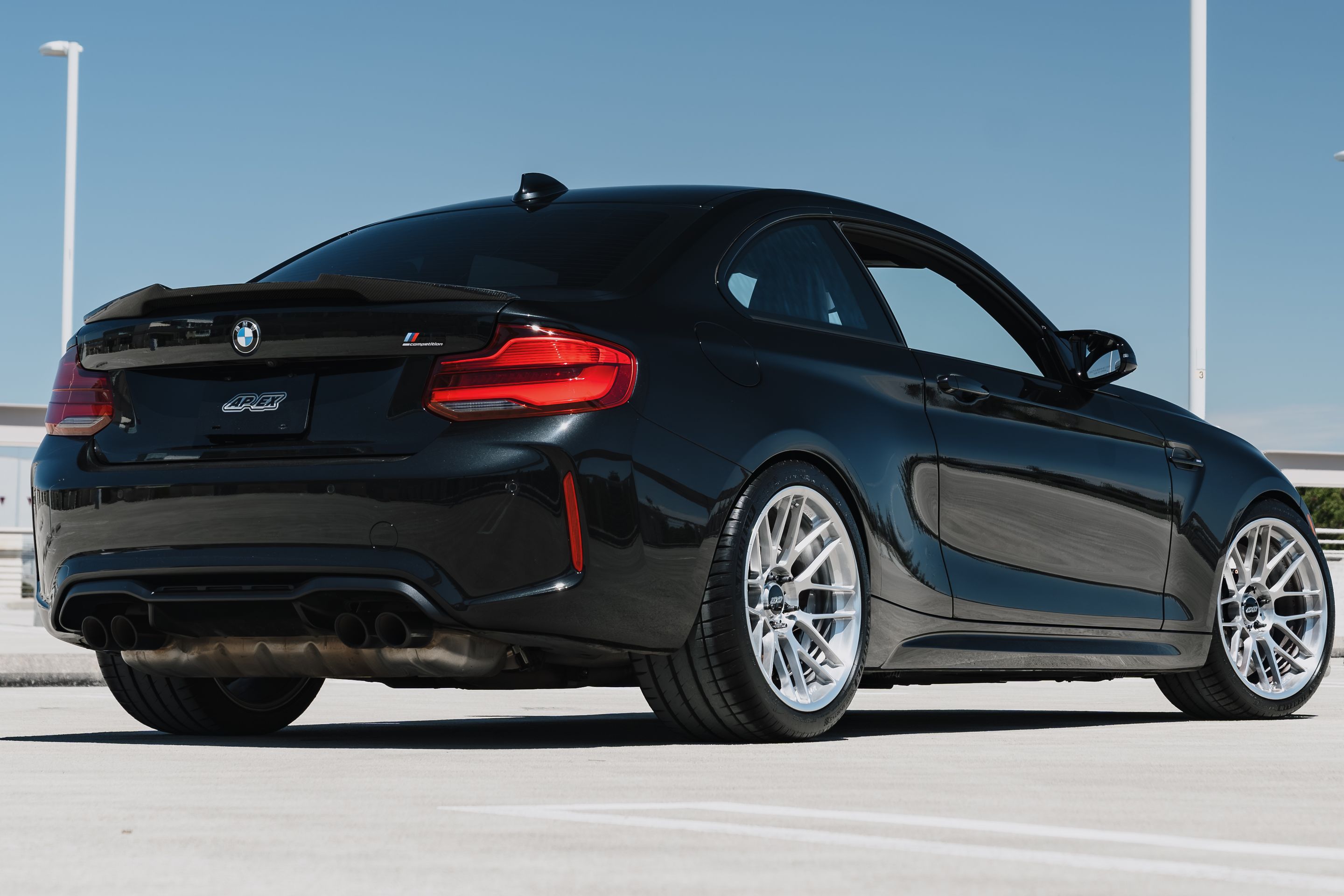 Black BMW F87 M2 with 19" ARC-8RT Apex wheels in Brushed Clear