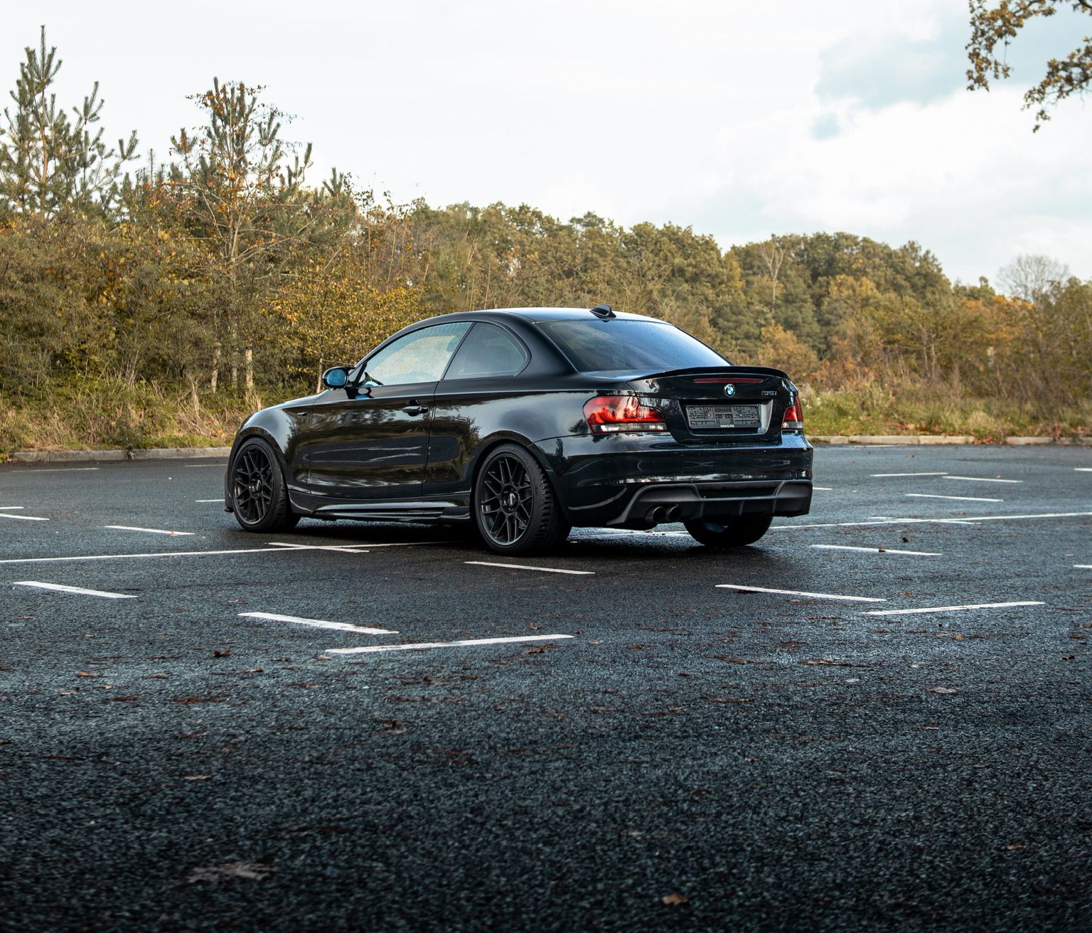 Black BMW E82 Coupe 1 Series with 18" ARC-8 Apex wheels in Satin Black