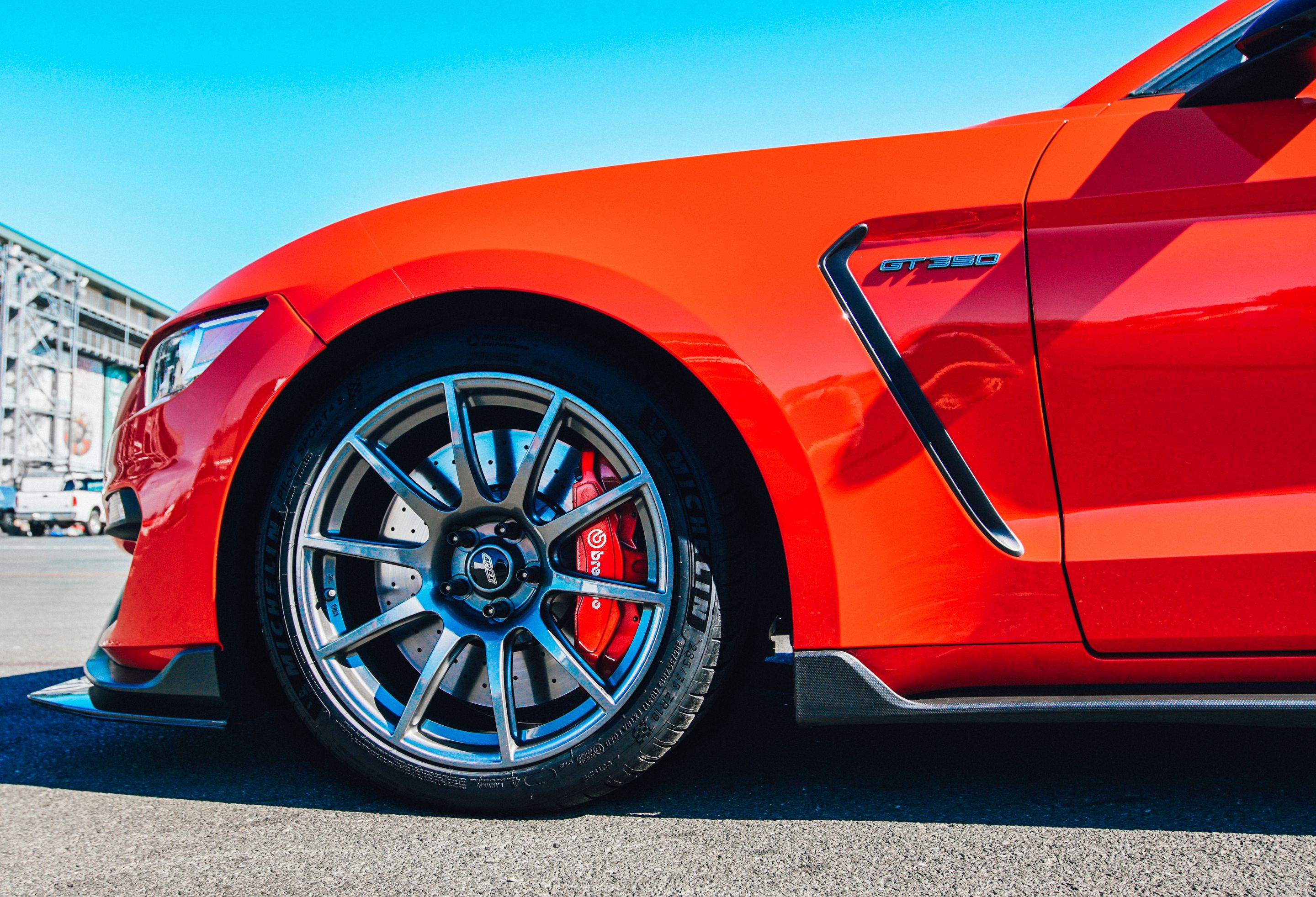 Red Ford S550 Mustang GT350 with 19" SM-10 Apex wheels in Anthracite