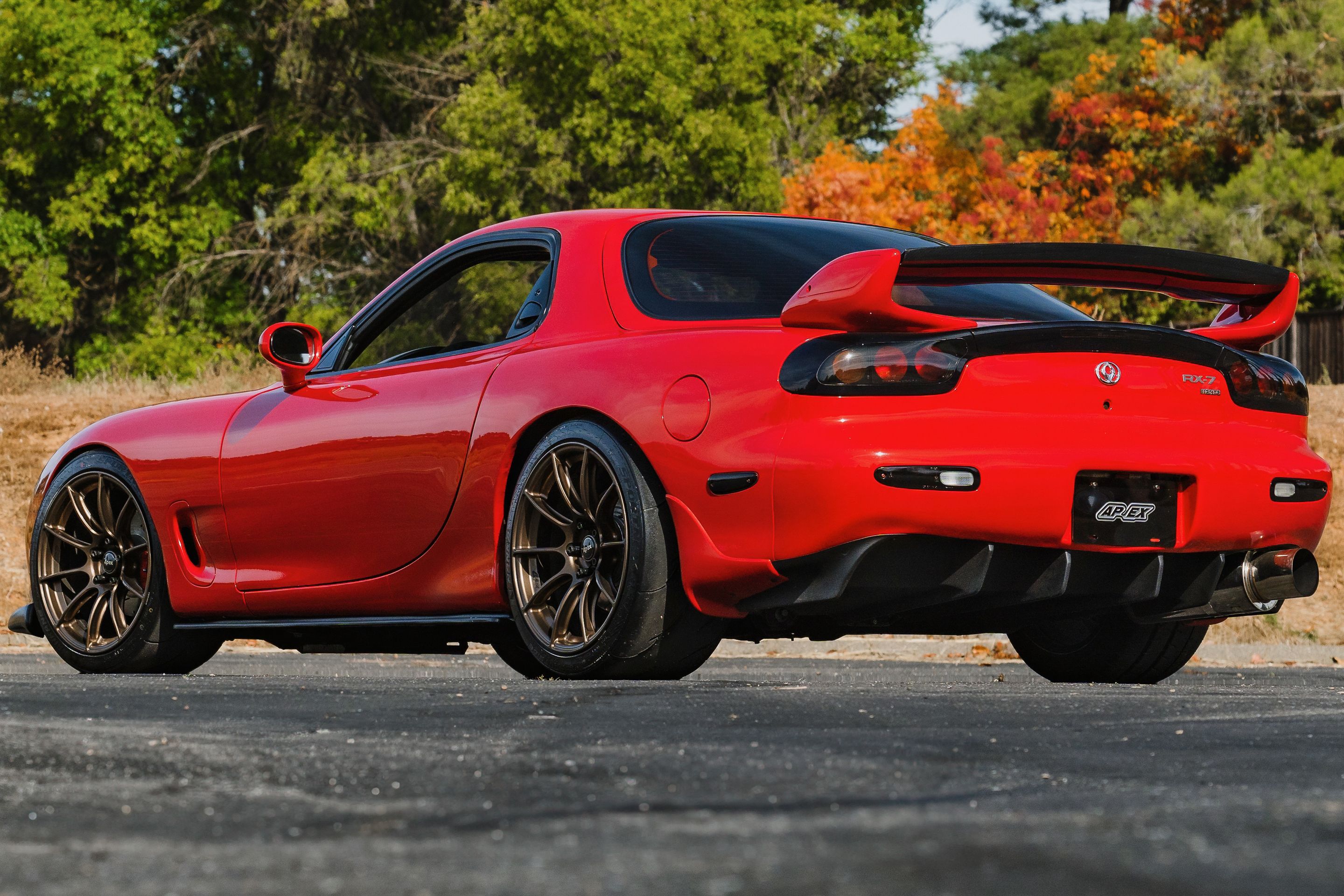 Red Mazda FD RX-7 with 18" SM-10RS Apex wheels in Satin Bronze