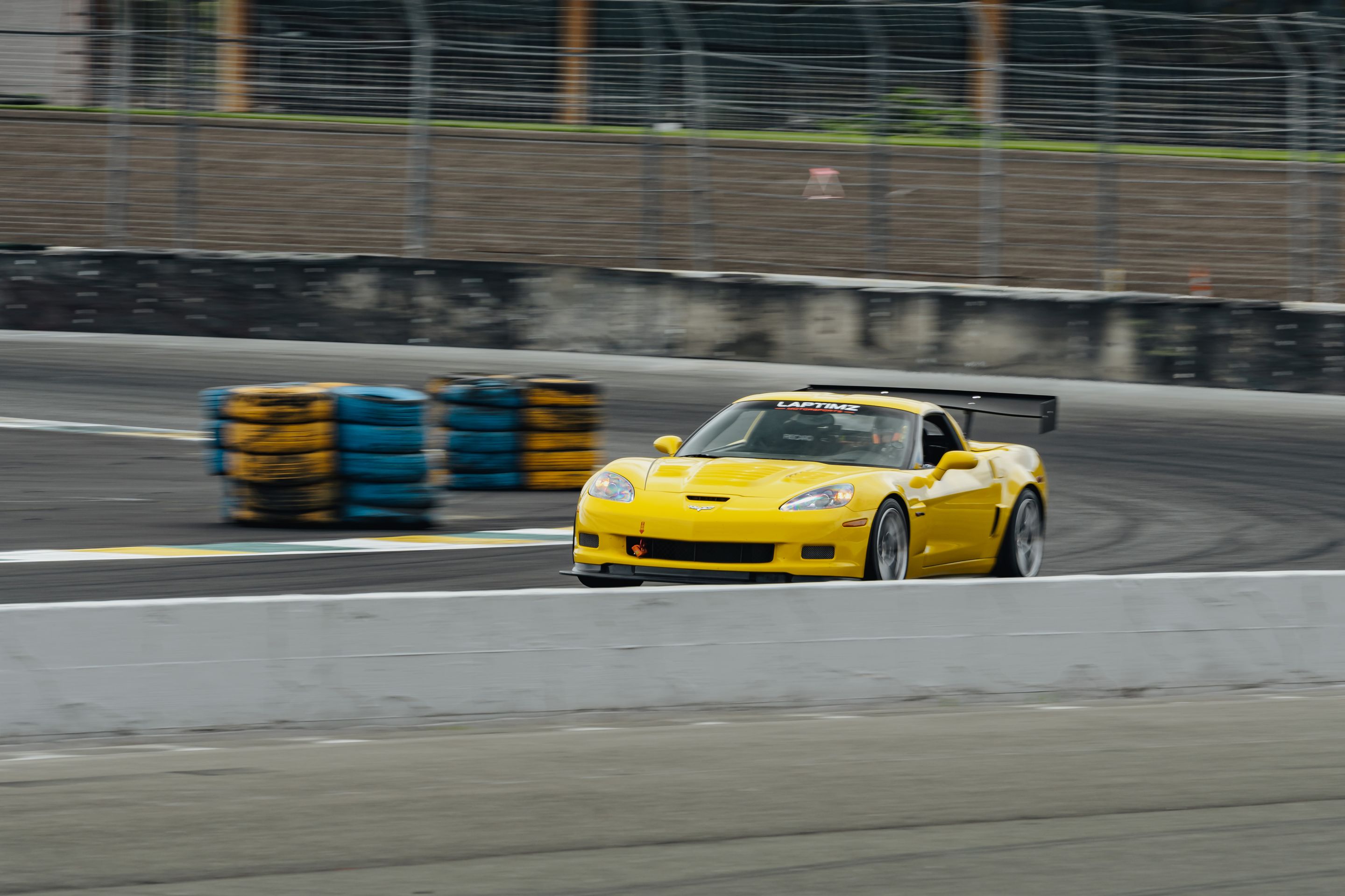Yellow Chevrolet C6 Corvette Z06 with 18" VS-5RS Apex wheels in Brushed Clear