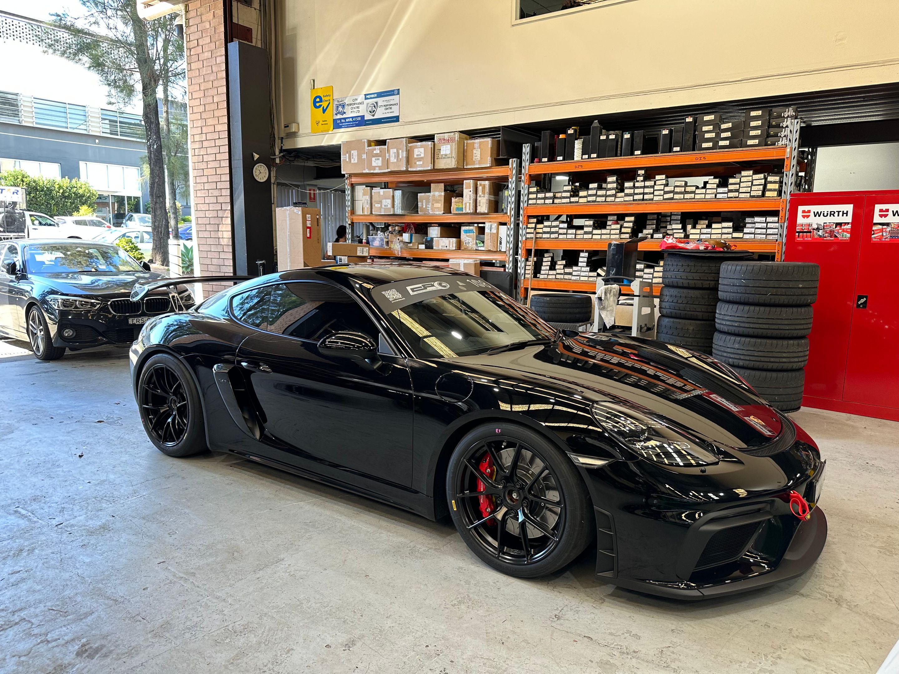 Black Porsche 718 Cayman GT4 with 19" VS-5RS Apex wheels in Satin Black