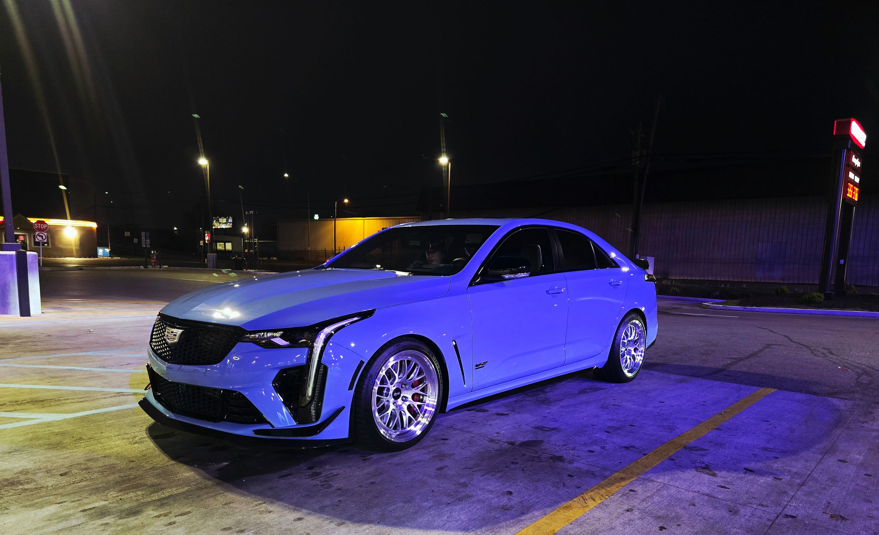 Blue Cadillac CT4-V Blackwing with 18" ML-10RT Apex wheels in Machined Lip Brushed Clear