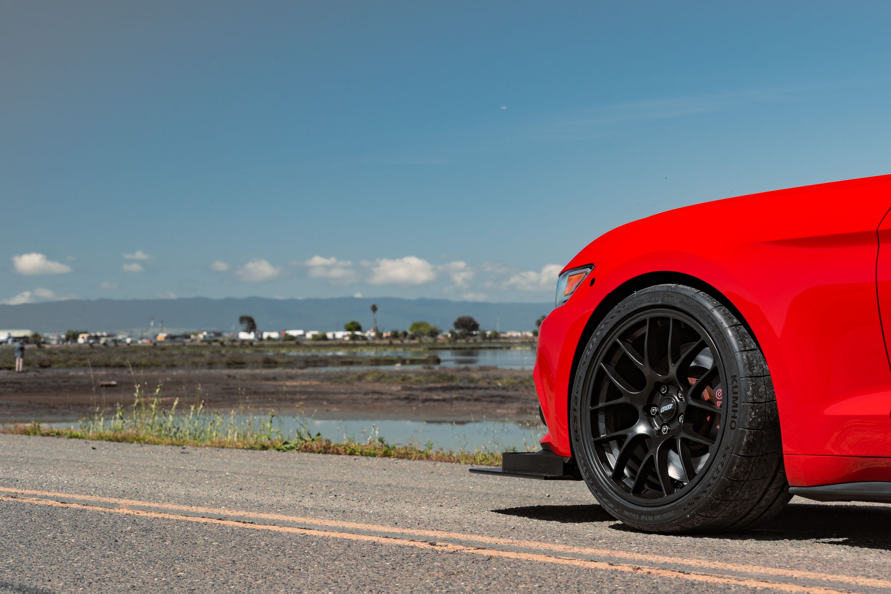 Red Ford S550 Mustang GT with 19" EC-7 Apex wheels in Satin Black