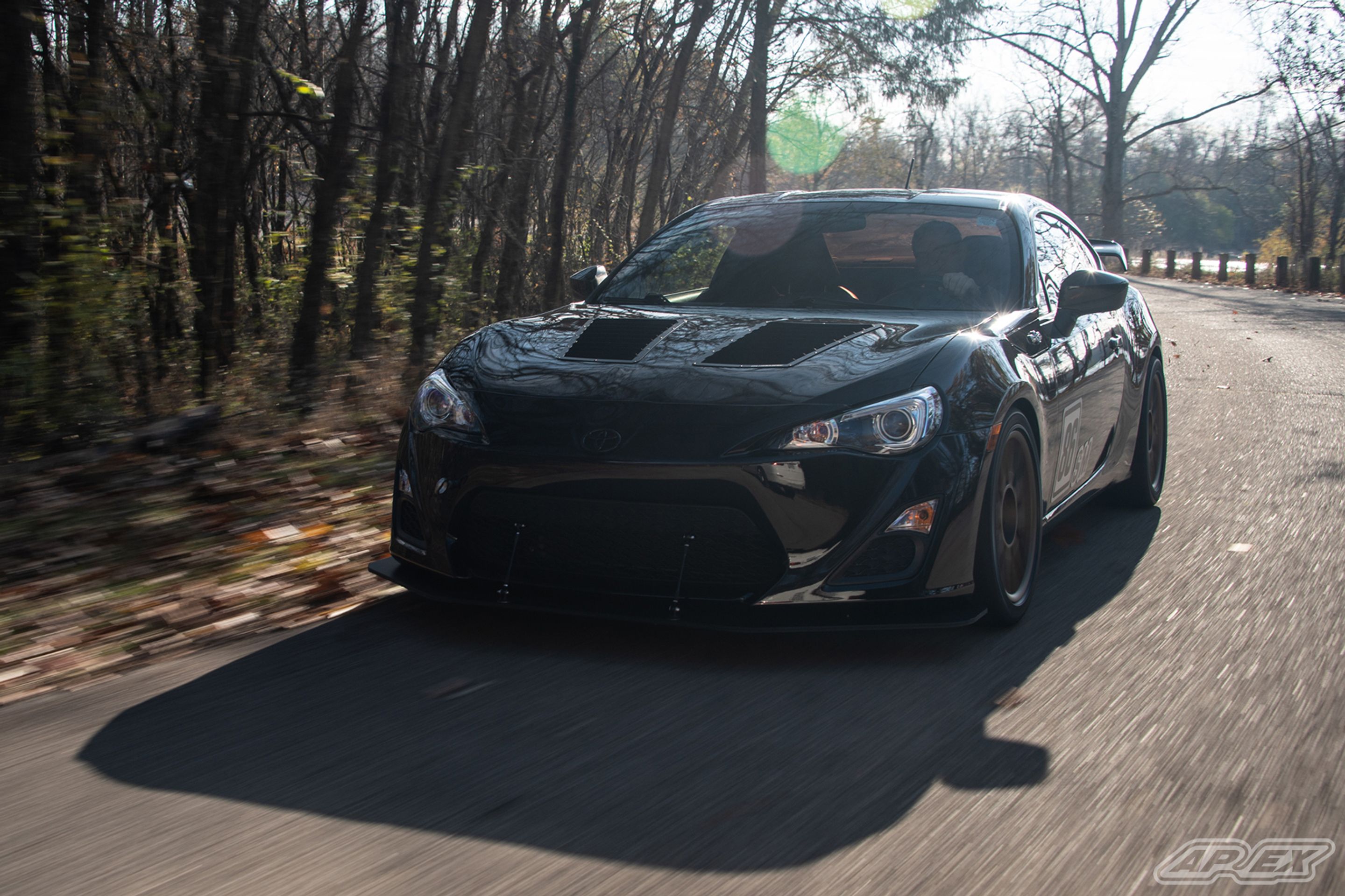 Black Scion FR-S with 17" ARC-8 Apex wheels in Satin Bronze