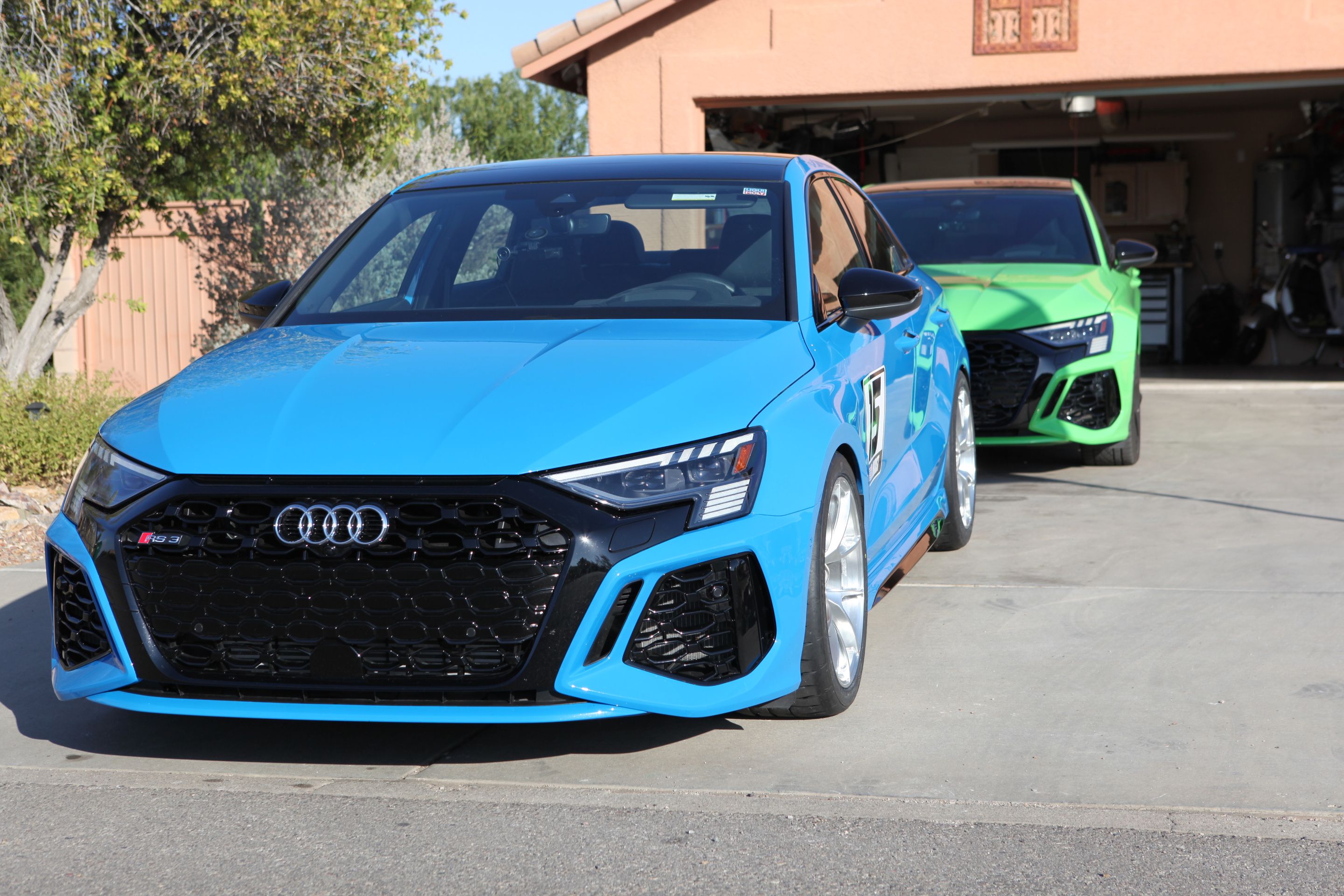 Blue Audi 8Y RS 3 with 18" VS-5RS Apex wheels in Brushed Clear