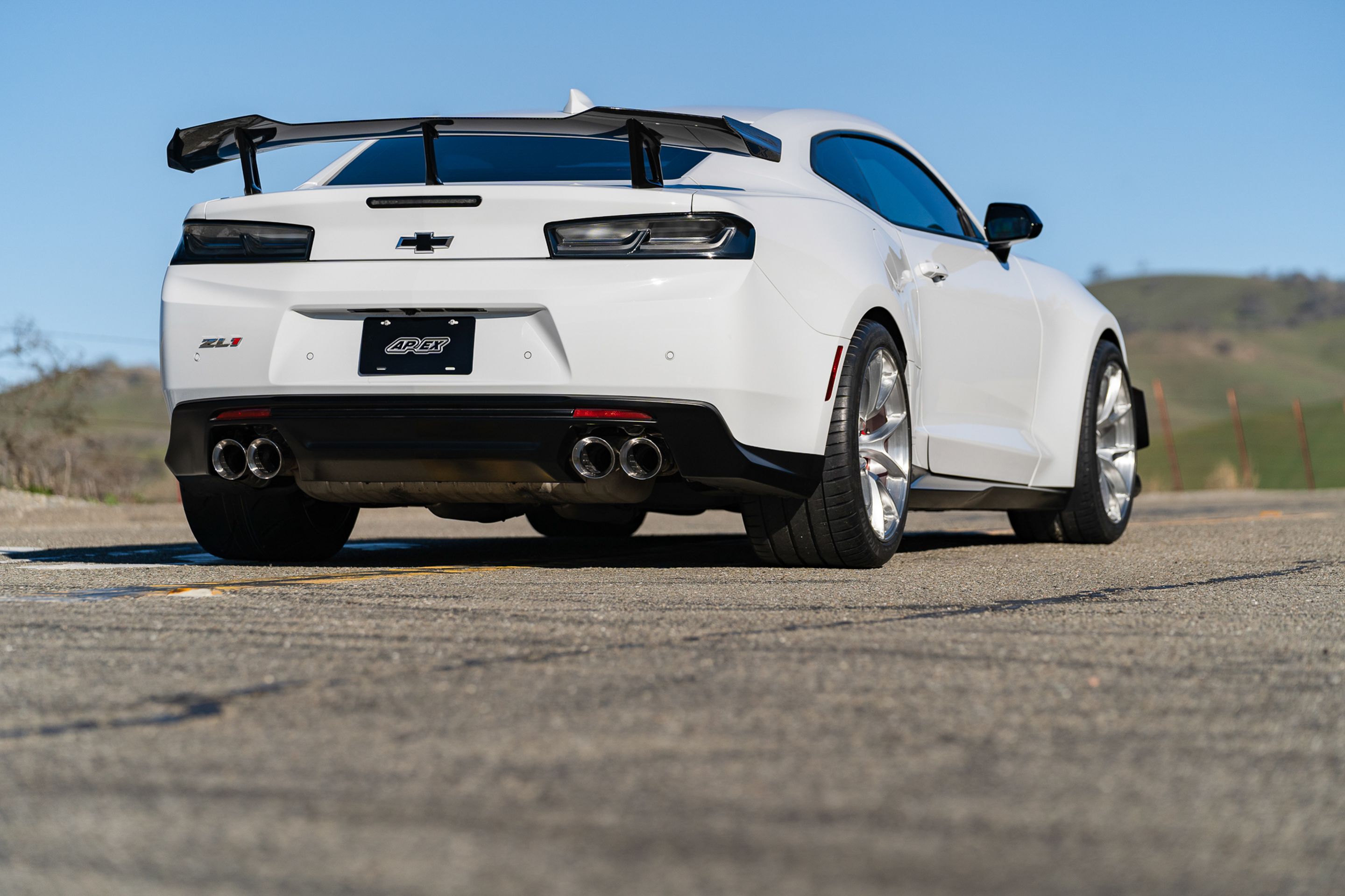 White Chevrolet 6th Gen Camaro ZL1 1LE with 19" VS-5RS Apex wheels in Brushed Clear