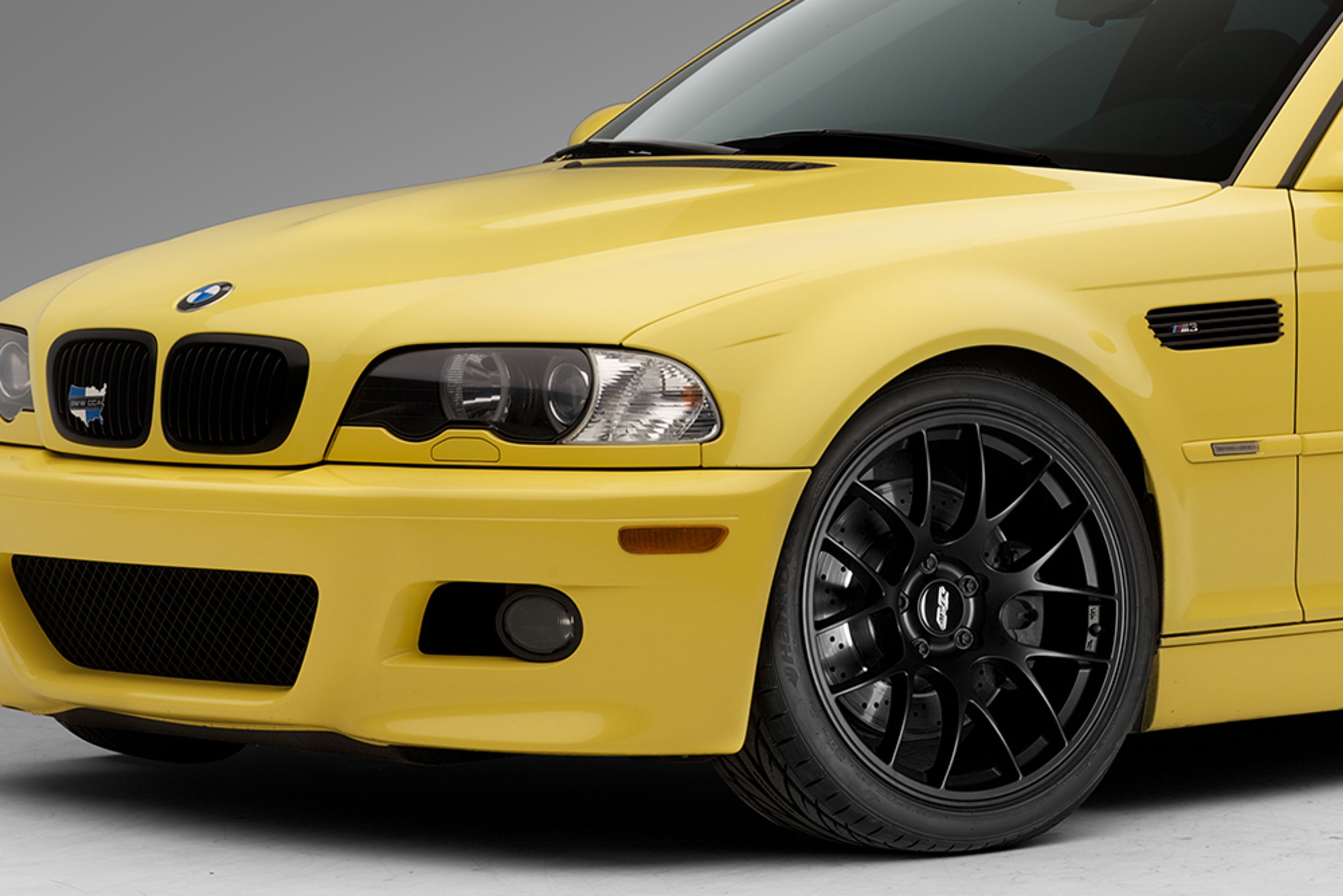 Yellow BMW E46 M3 with 19" EC-7 Apex wheels in Satin Black