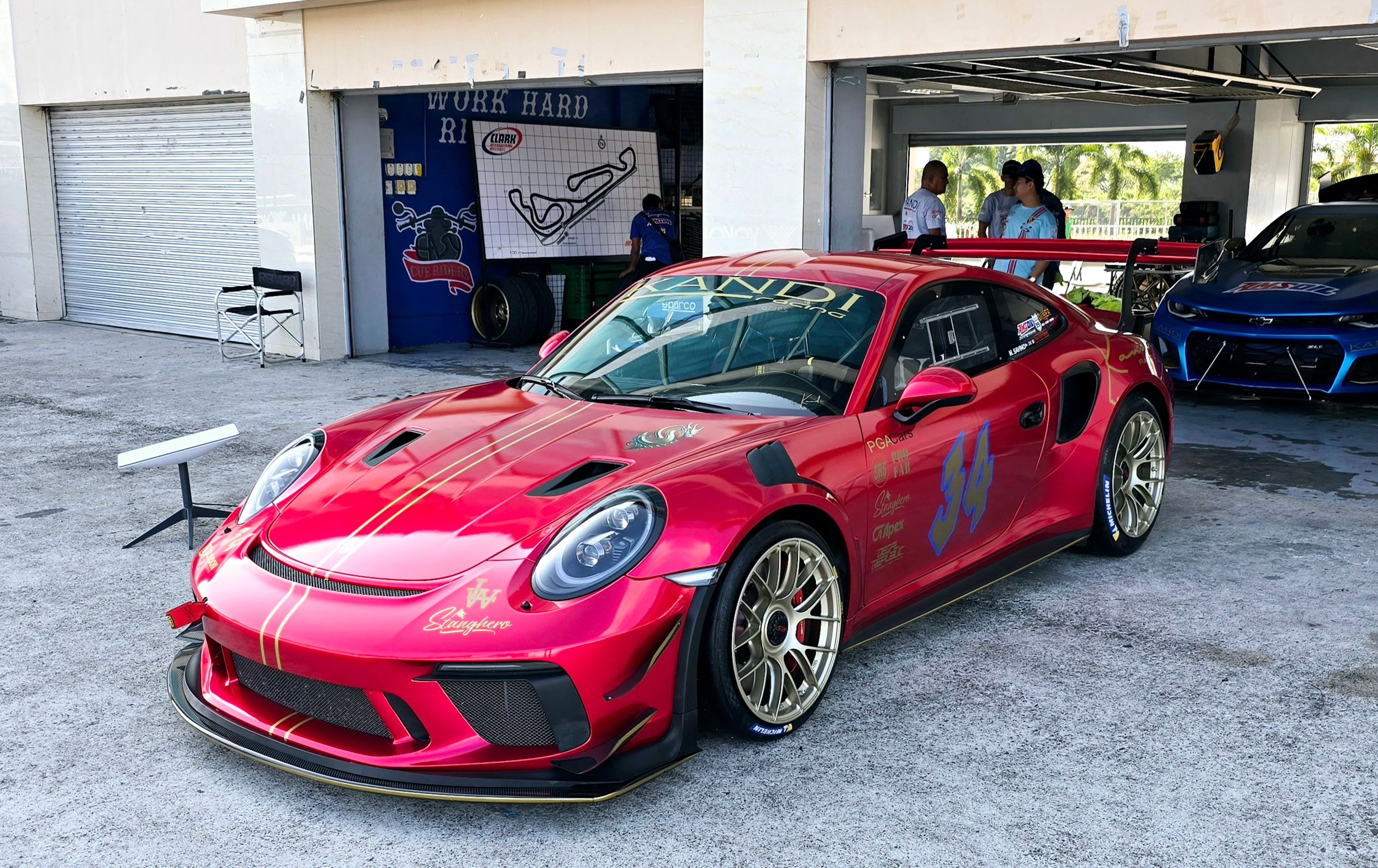 Red Porsche 911 991.2 GT3 RS with 19" EC-7RS Apex wheels in Motorsport Gold