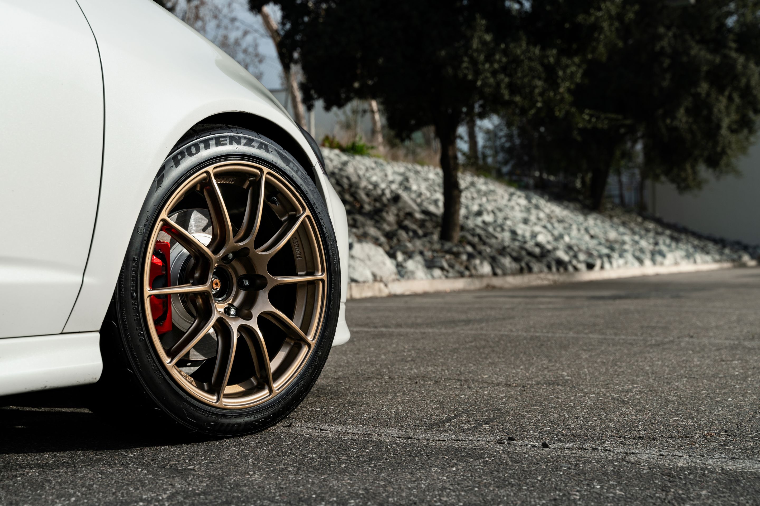 White Acura DC5 RSX with 17" SM-10RS Apex wheels in Satin Bronze