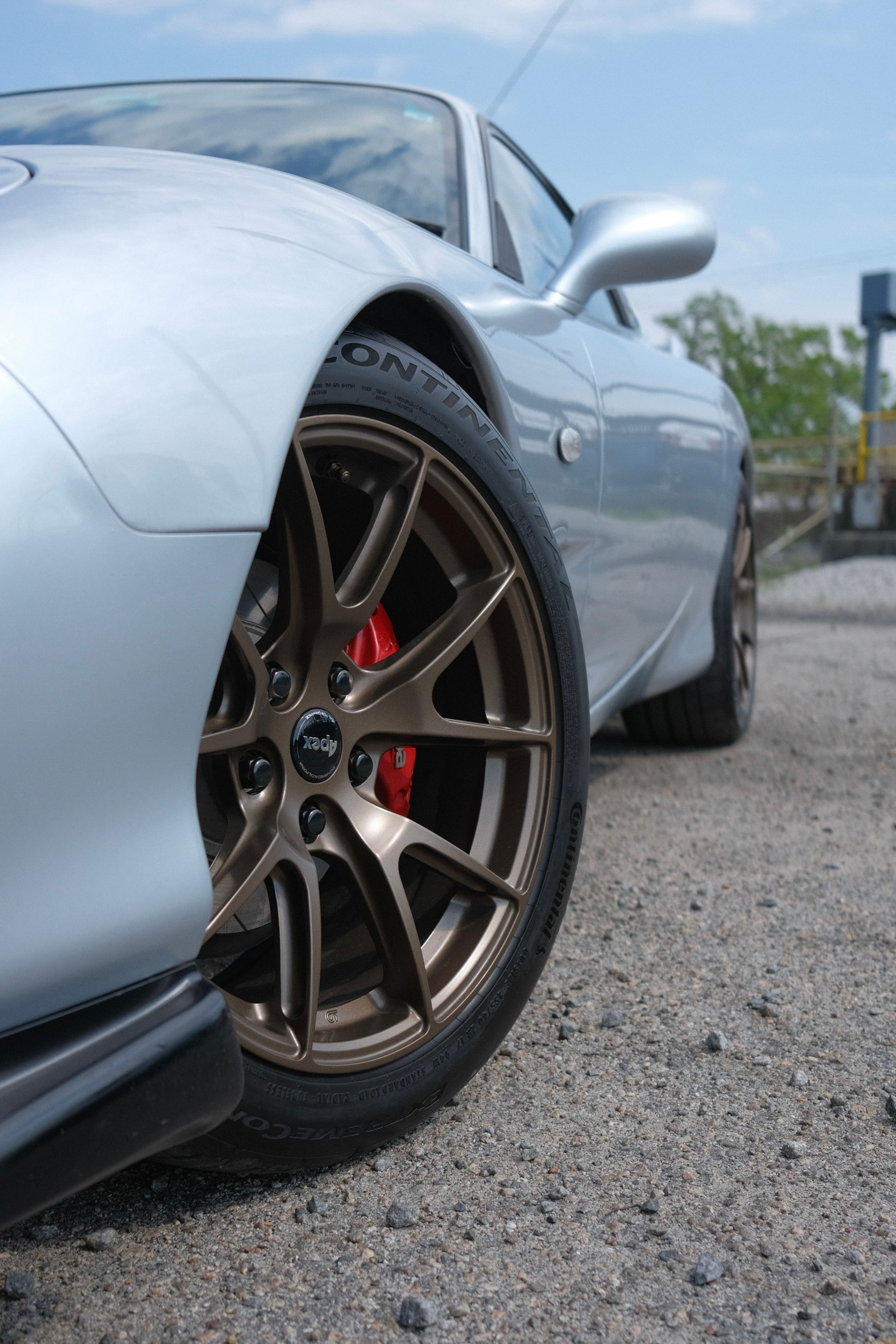 Silver Mazda FD RX-7 with 17" VS-5 Apex wheels in Satin Bronze