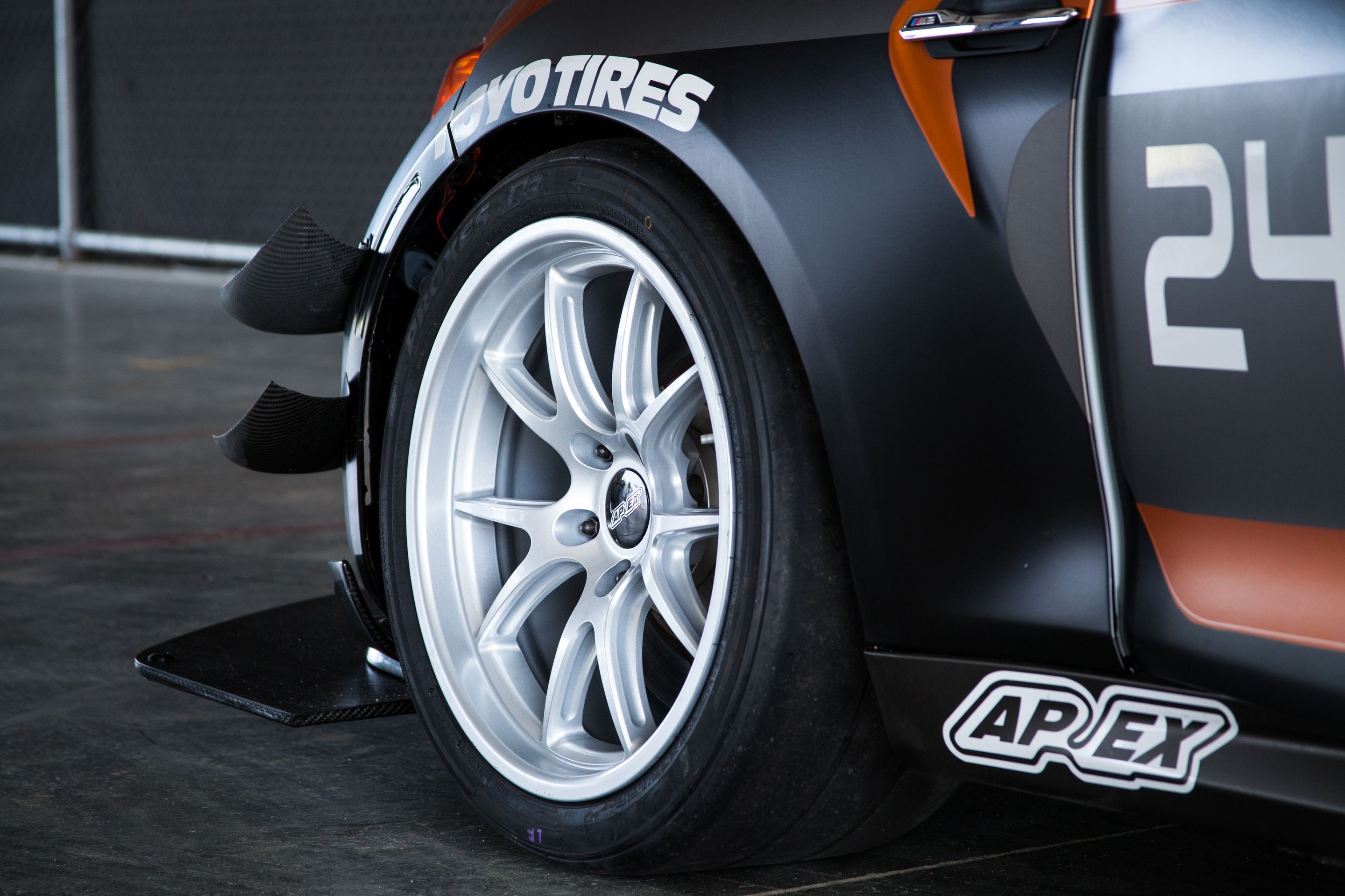 Multicolor BMW F87 M2 with 18" FL-5 Apex wheels in Race Silver