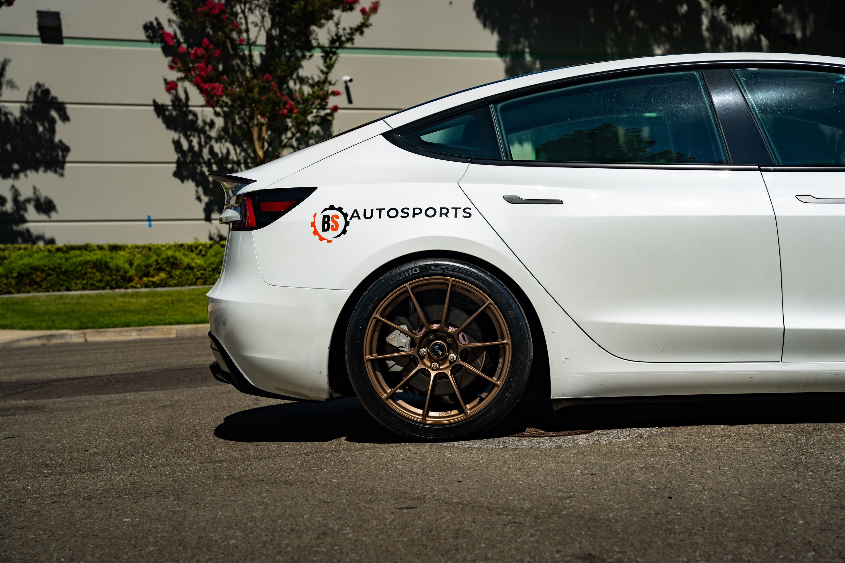 White Tesla Model 3 with 19" SM-10RS Apex wheels in Satin Bronze