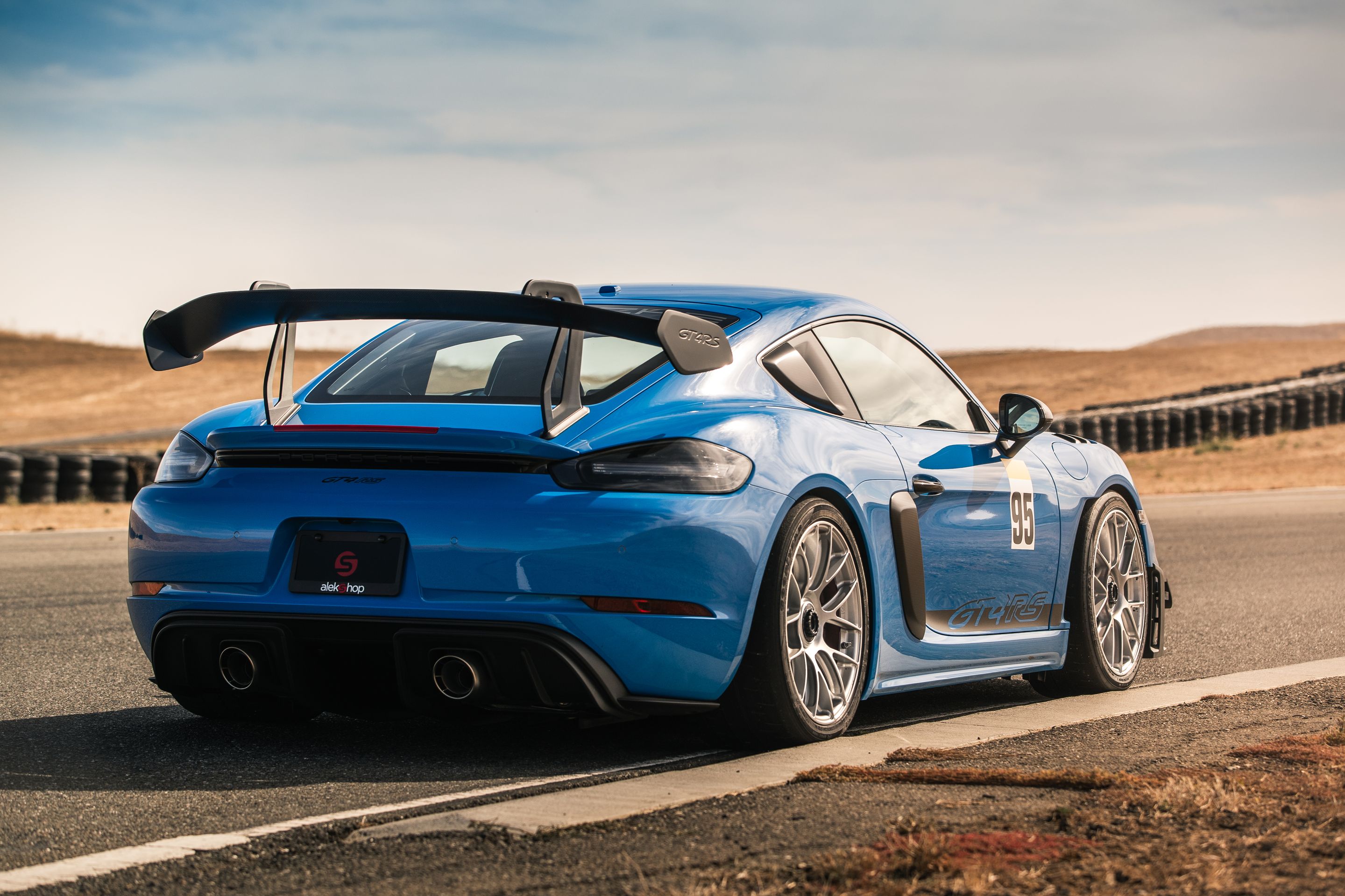 Blue Porsche 718 Cayman GT4 RS with 19" EC-7RS Apex wheels in Race Silver