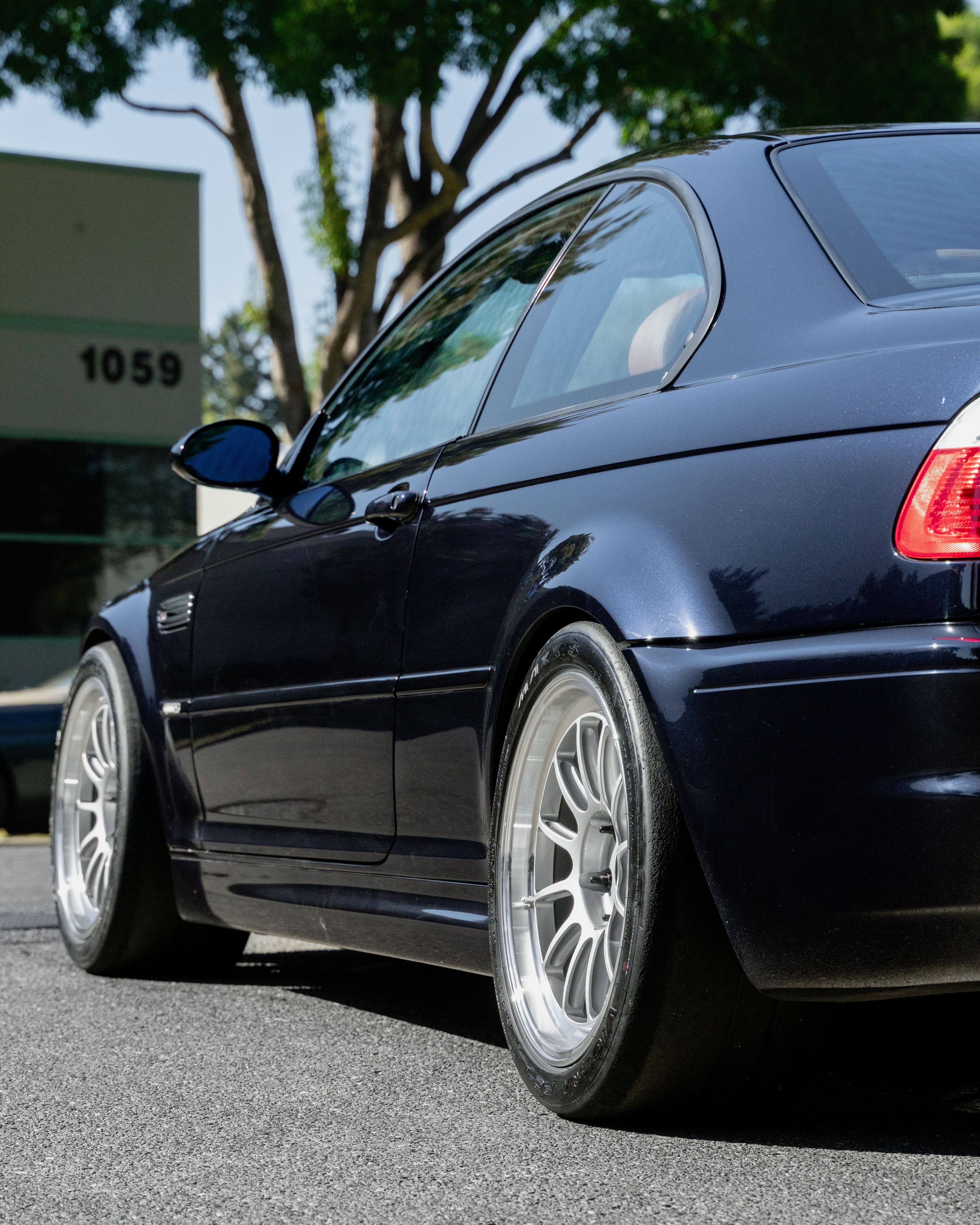 Black BMW E46 M3 with 18" SL-12 Apex wheels in Machined Lip Race Silver