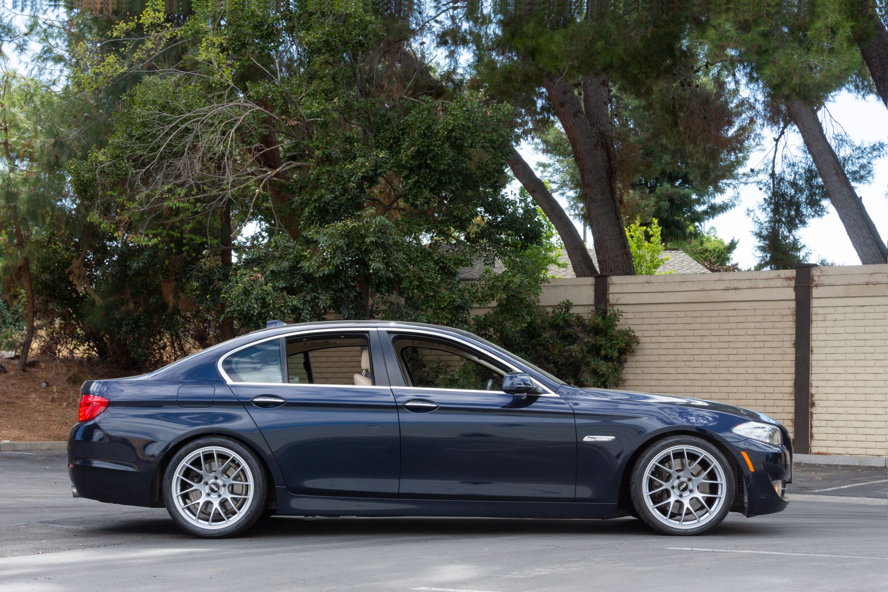 Black BMW F10 Sedan 5 Series with 19" EC-7 Apex wheels in Race Silver