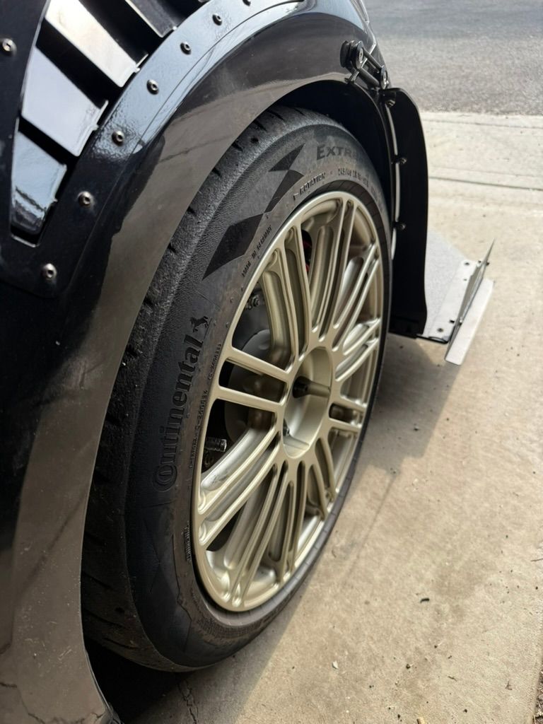 Black VW MK7 GTI with 18" TC-10RT Apex wheels in Motorsport Gold