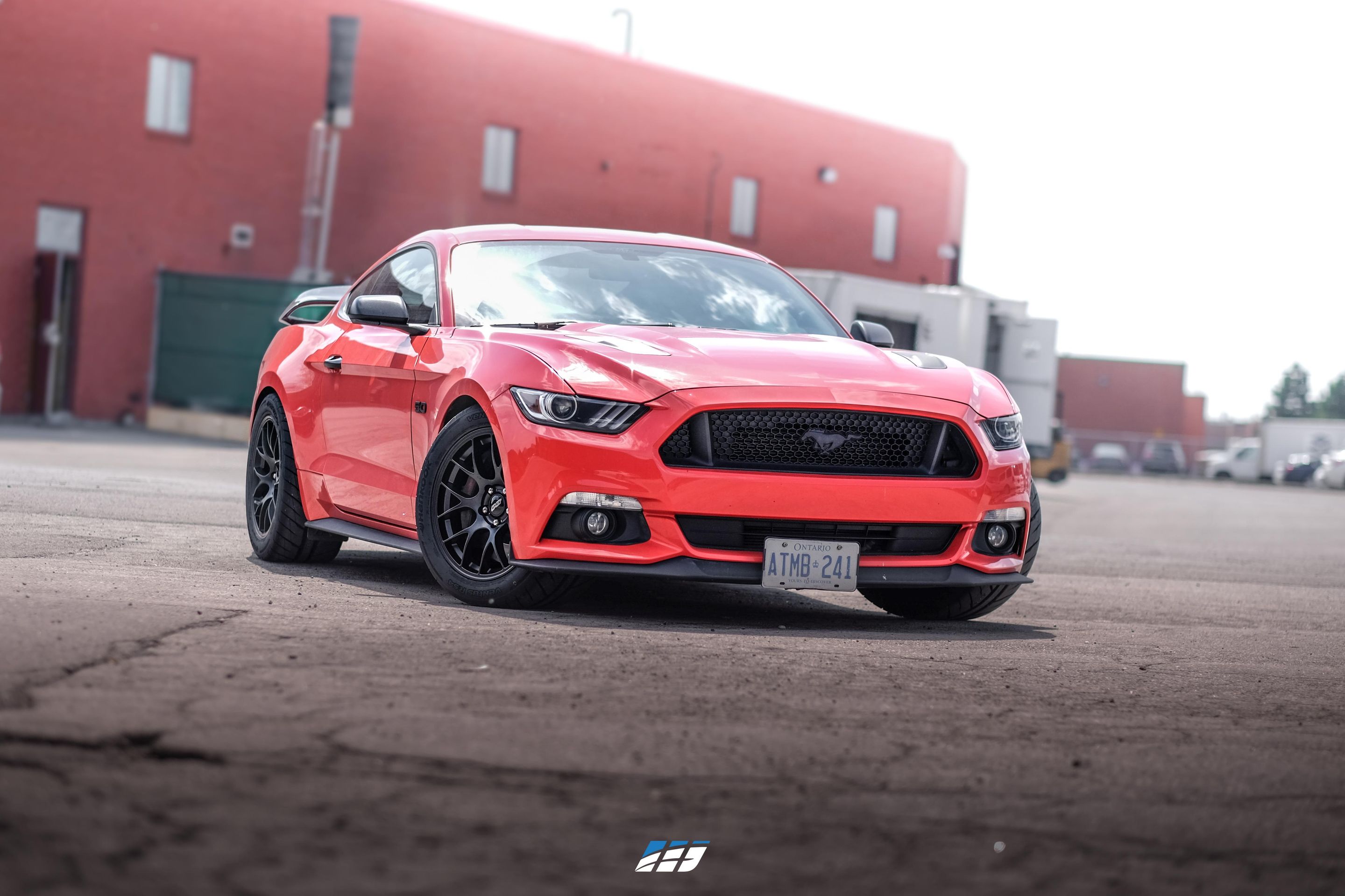 Red Ford S550 Mustang GT with 18" EC-7 Apex wheels in Satin Black