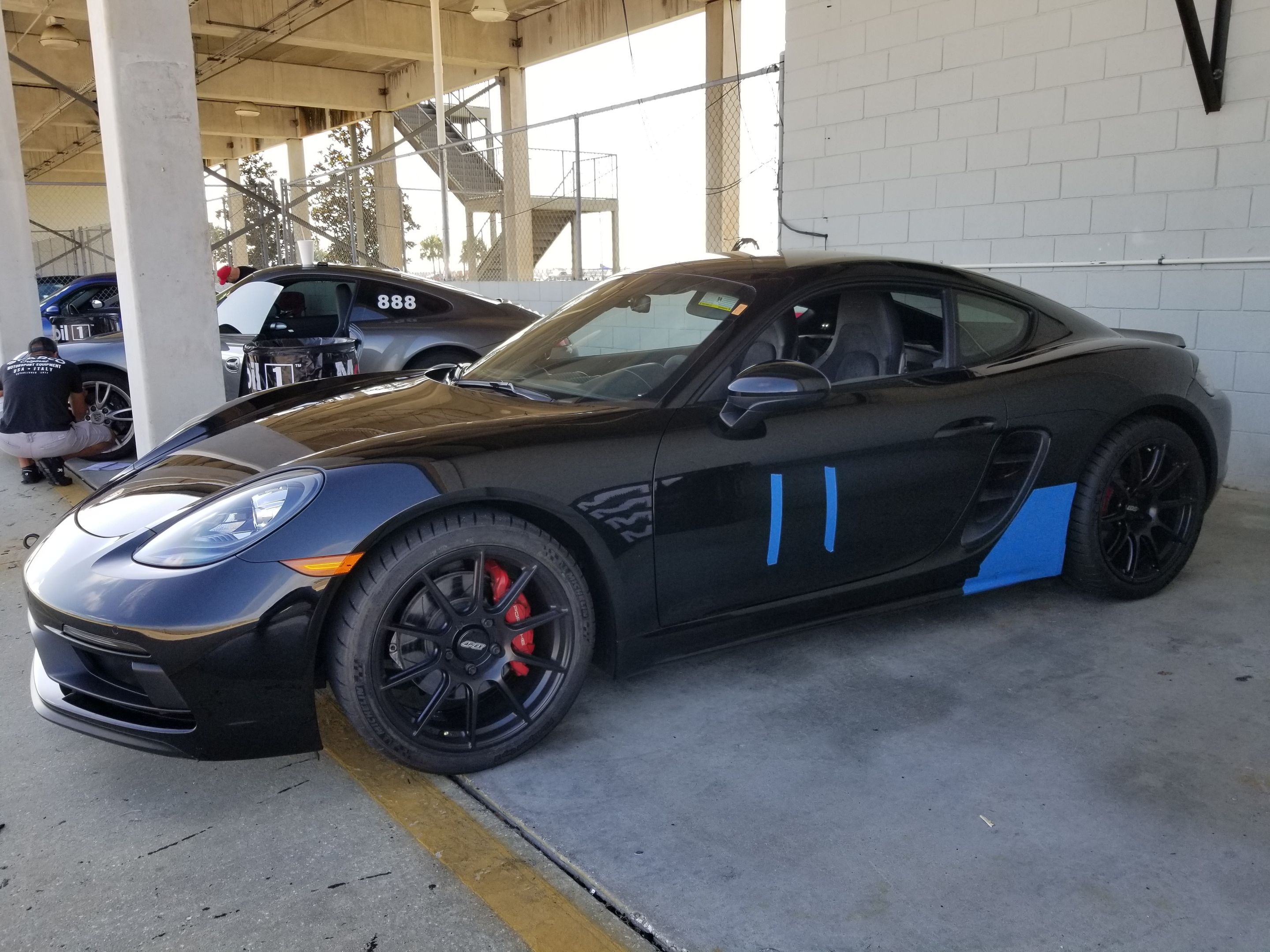 Black Porsche 718 Cayman GTS 2.5L with 19" SM-10 Apex wheels in Satin Black