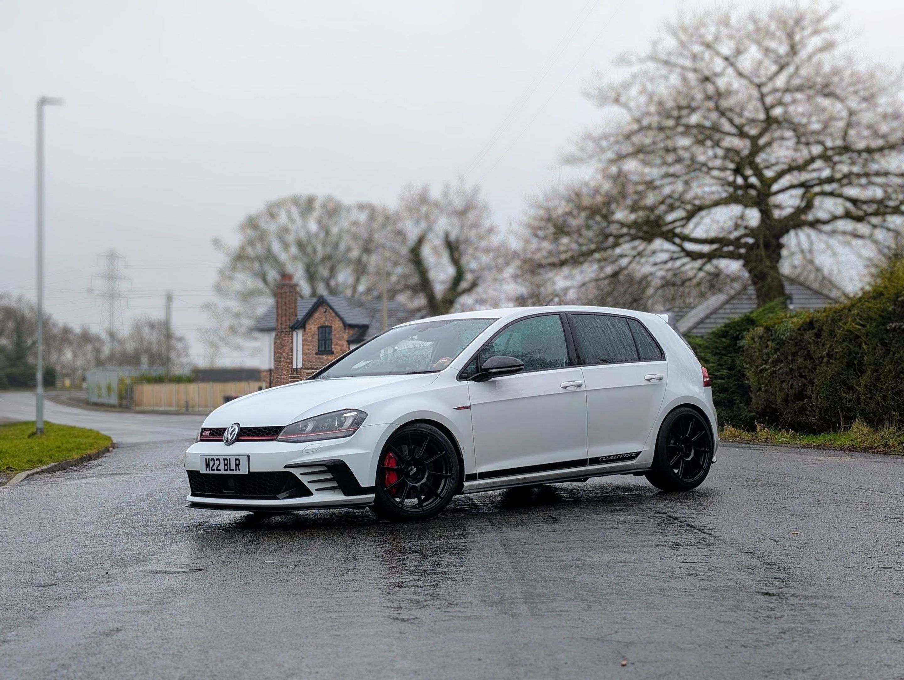 White VW MK7 GTI with 18" SM-10 Apex wheels in Satin Black