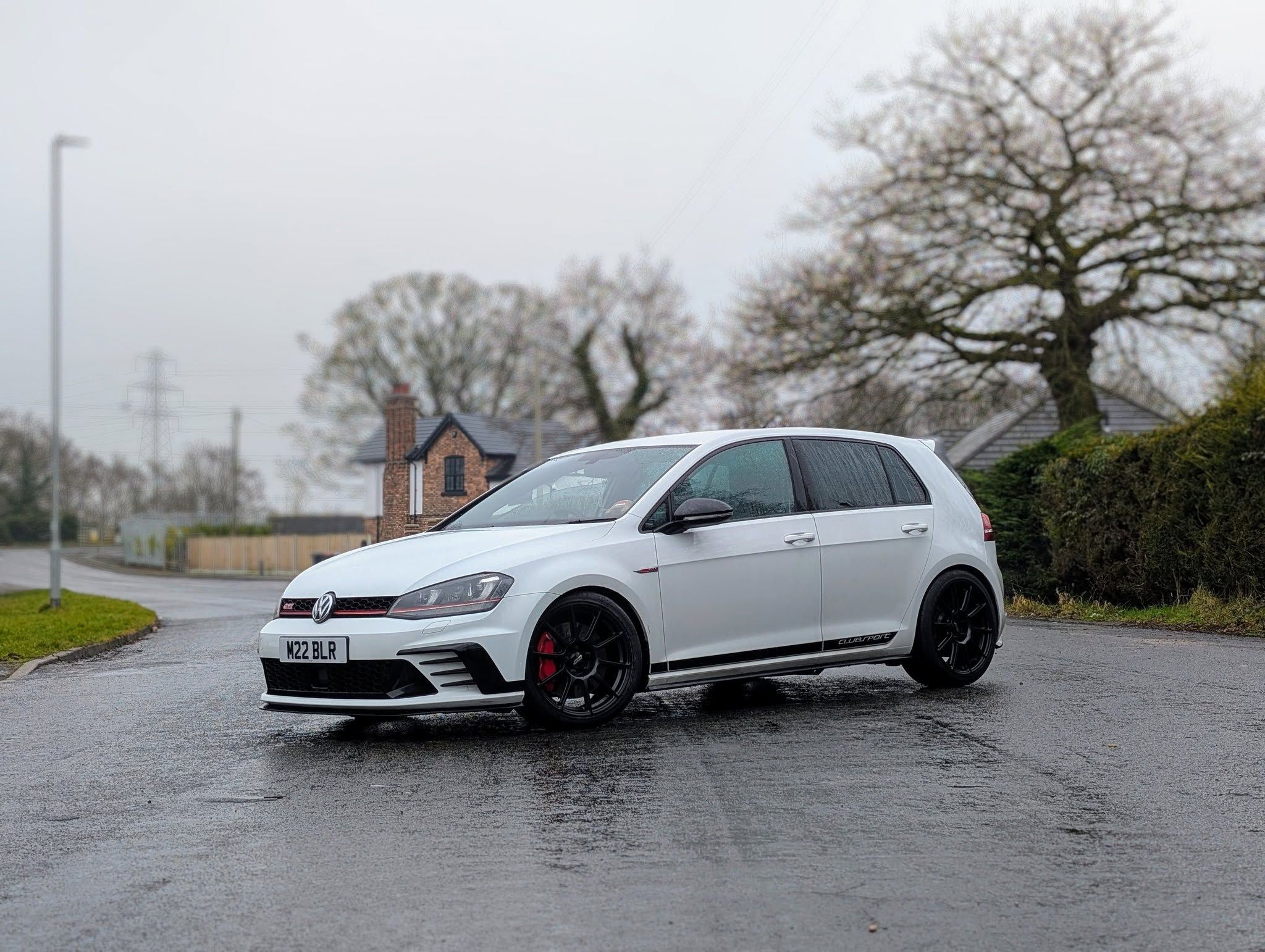 White VW MK7 GTI with 18" SM-10 Apex wheels in Satin Black