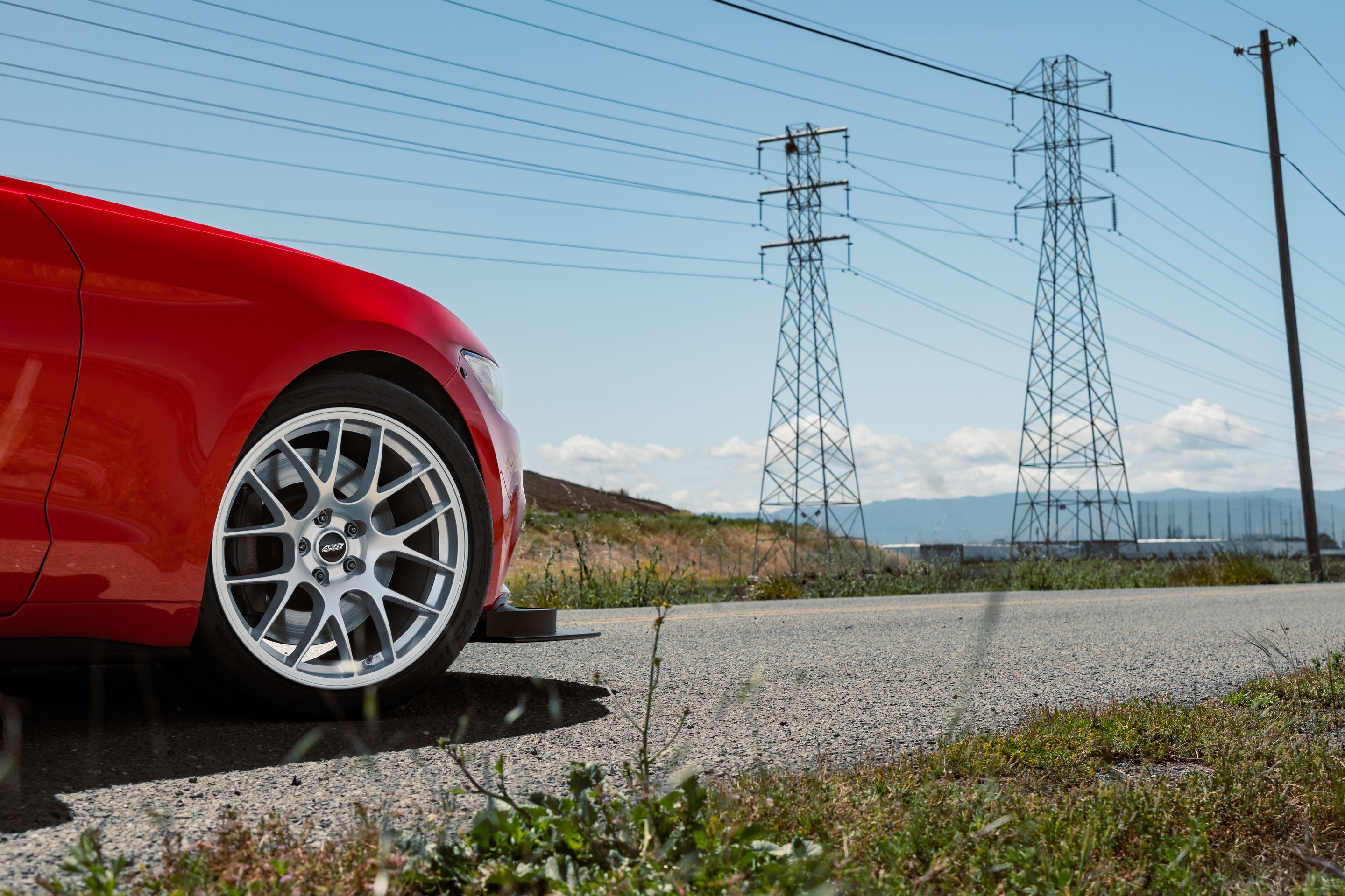 Red Ford S550 Mustang GT with 19" EC-7 Apex wheels in Race Silver