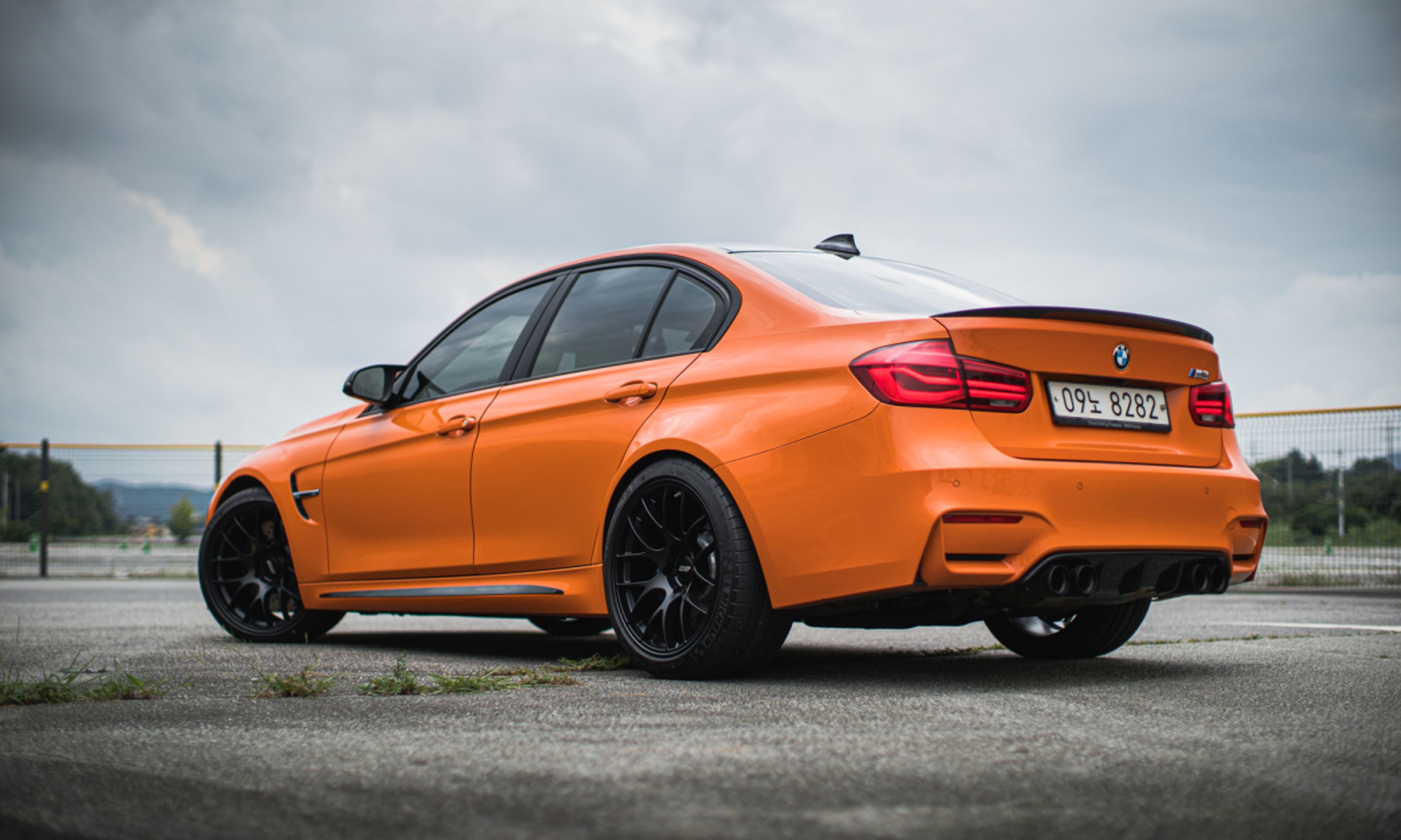 Orange BMW F80 M3 with 19" EC-7 Apex wheels in Satin Black