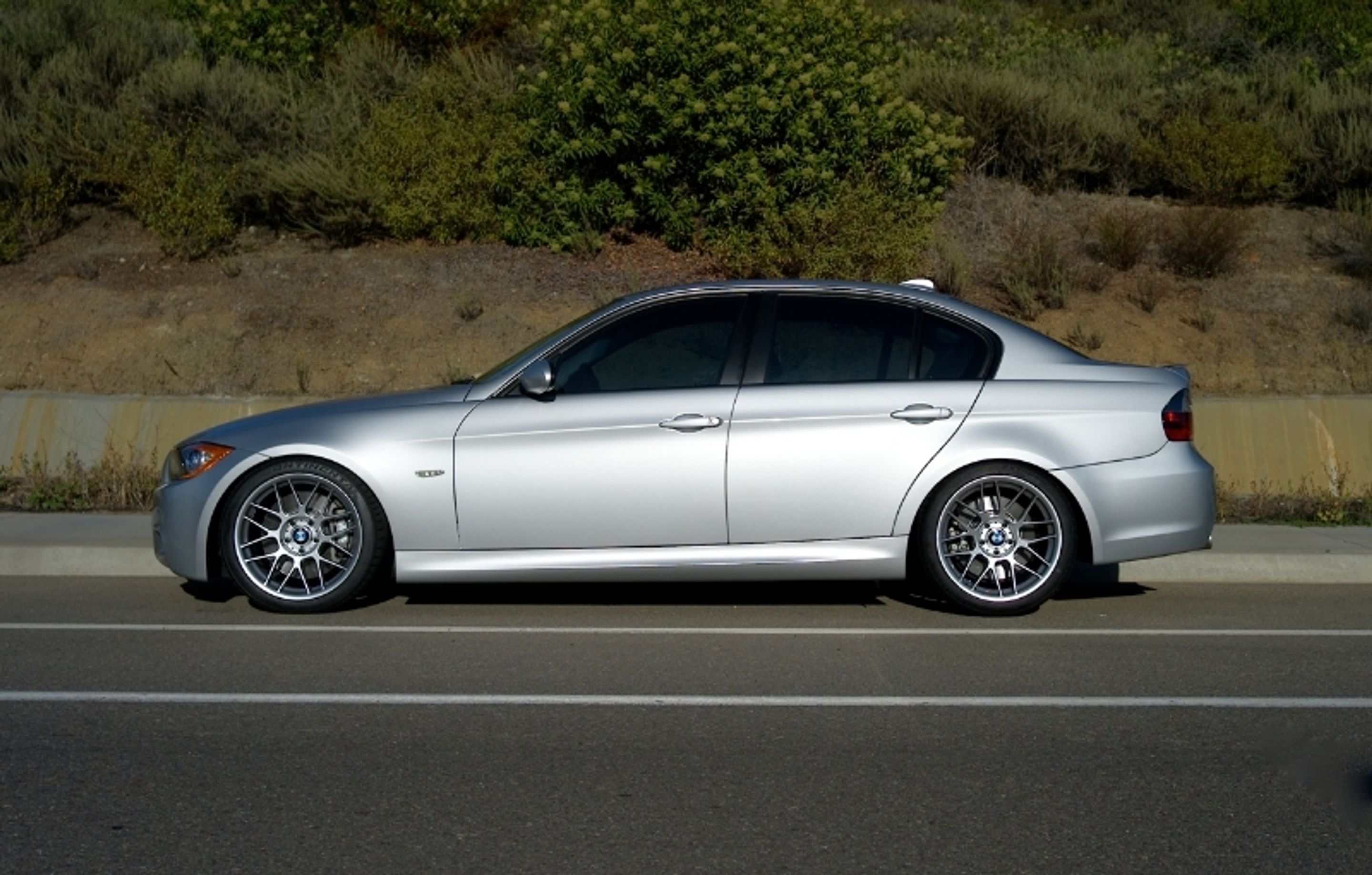 Silver BMW E90 Sedan 3 Series with 18" ARC-8 Apex wheels in Hyper Black