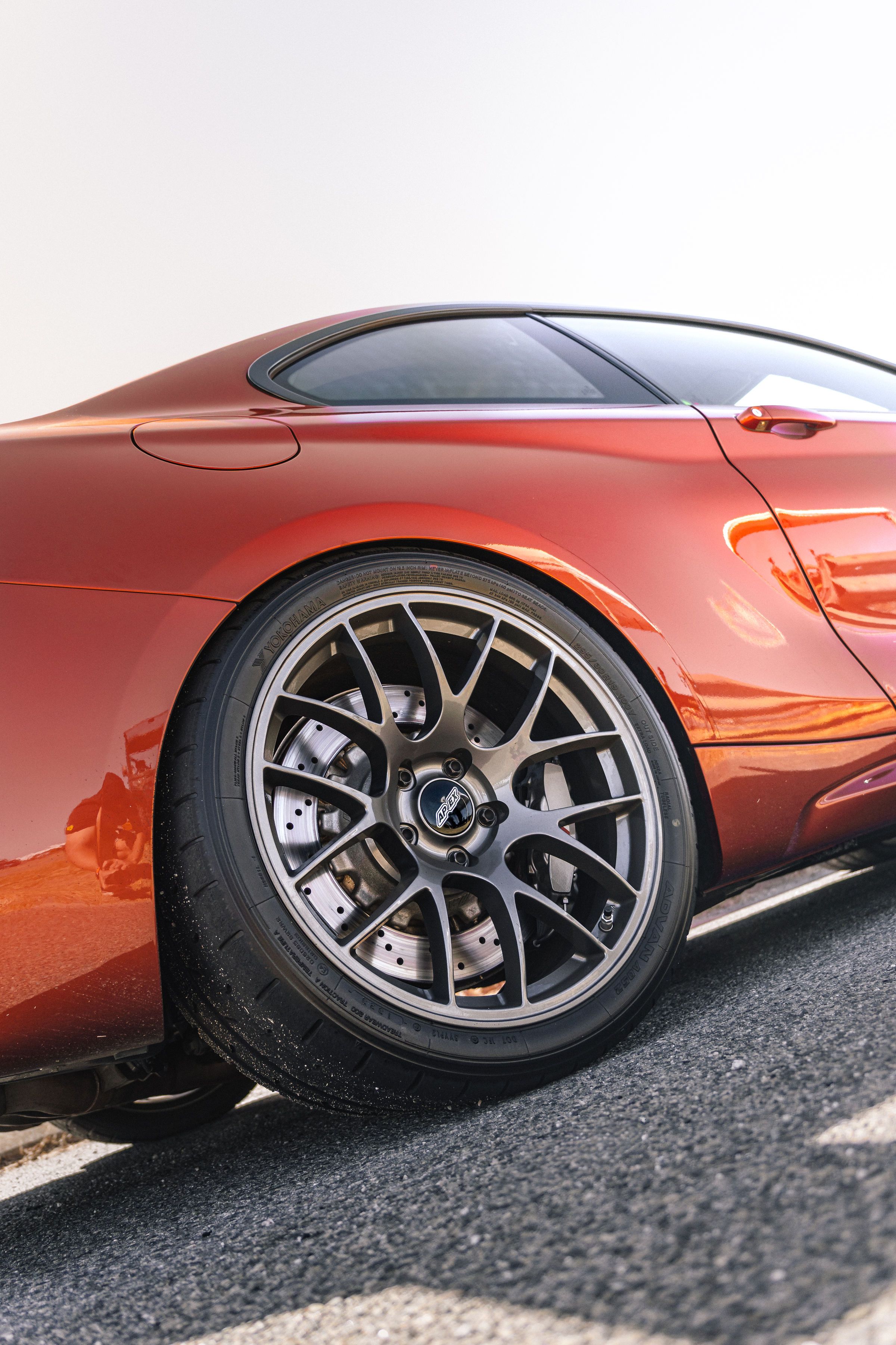 Orange BMW F87 M2 with 19" EC-7 Apex wheels in Anthracite