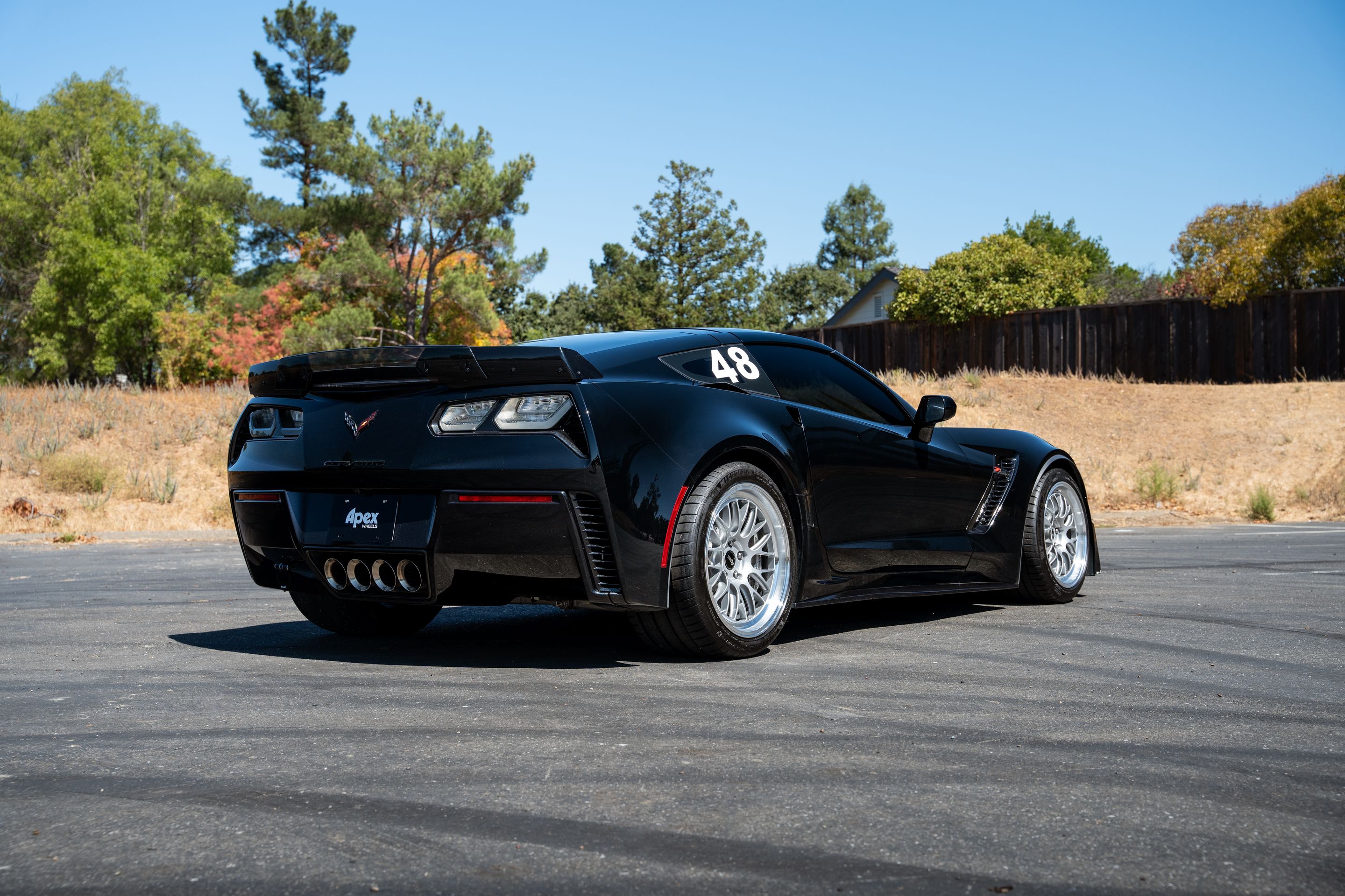 Black Chevrolet C7 Corvette Z06 with 18"/19" ML-10RT Apex wheels in Machined Lip Race Silver