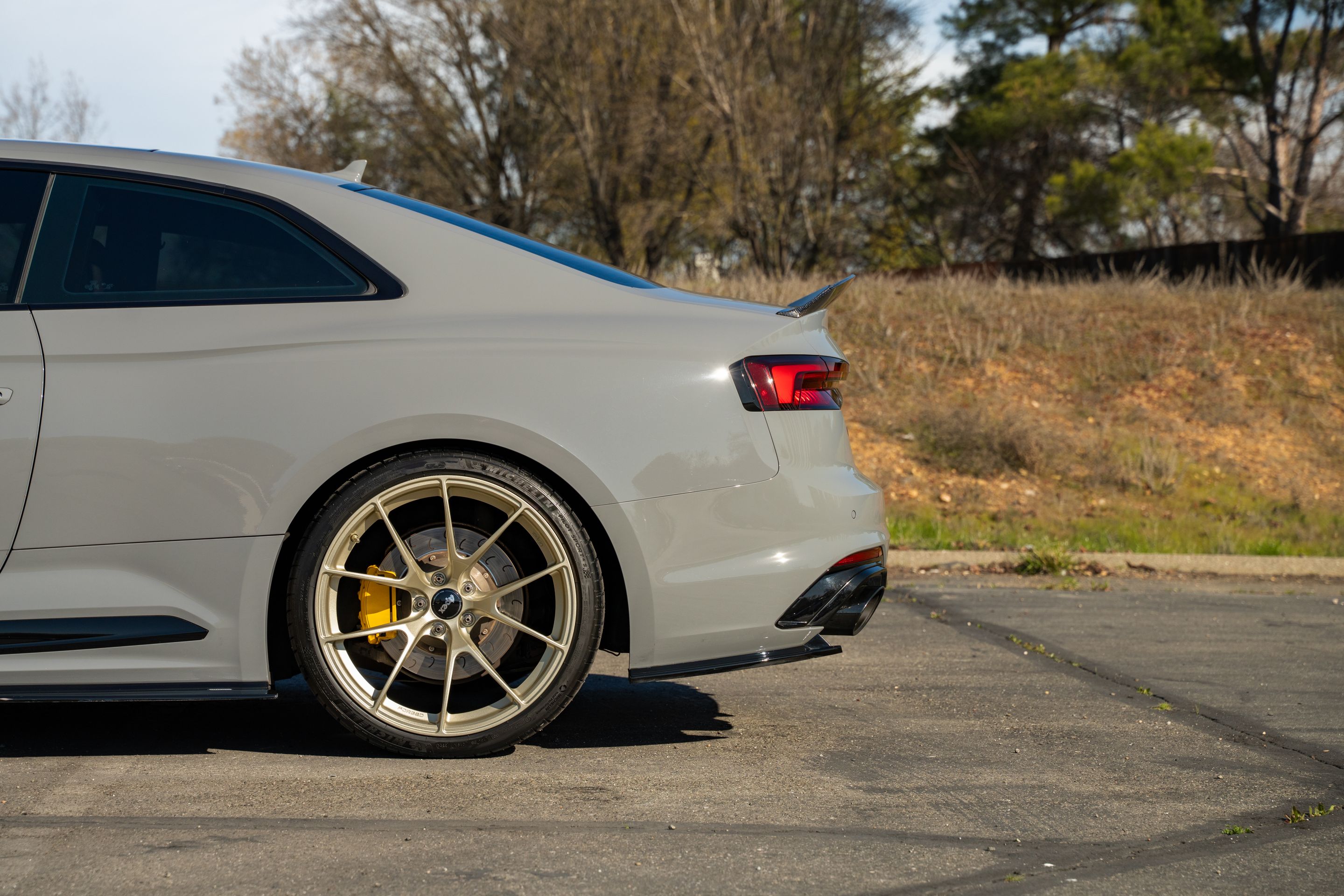 Grey Audi B9 RS 5 Coupe with 20" VS-5RS Apex wheels in Motorsport Gold