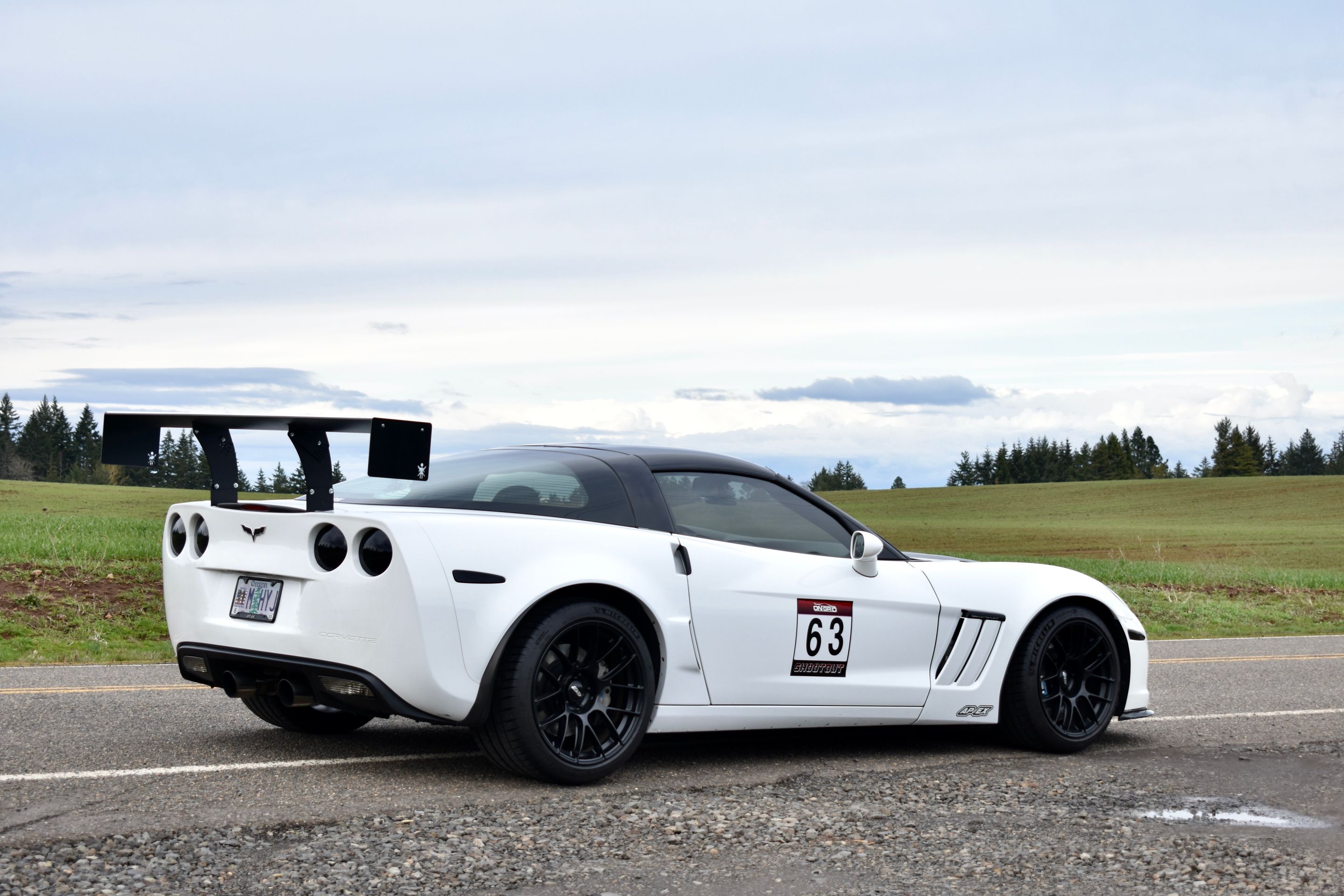White Chevrolet C6 Corvette Grand Sport with 18"/19" EC-7RS Apex wheels in Satin Black