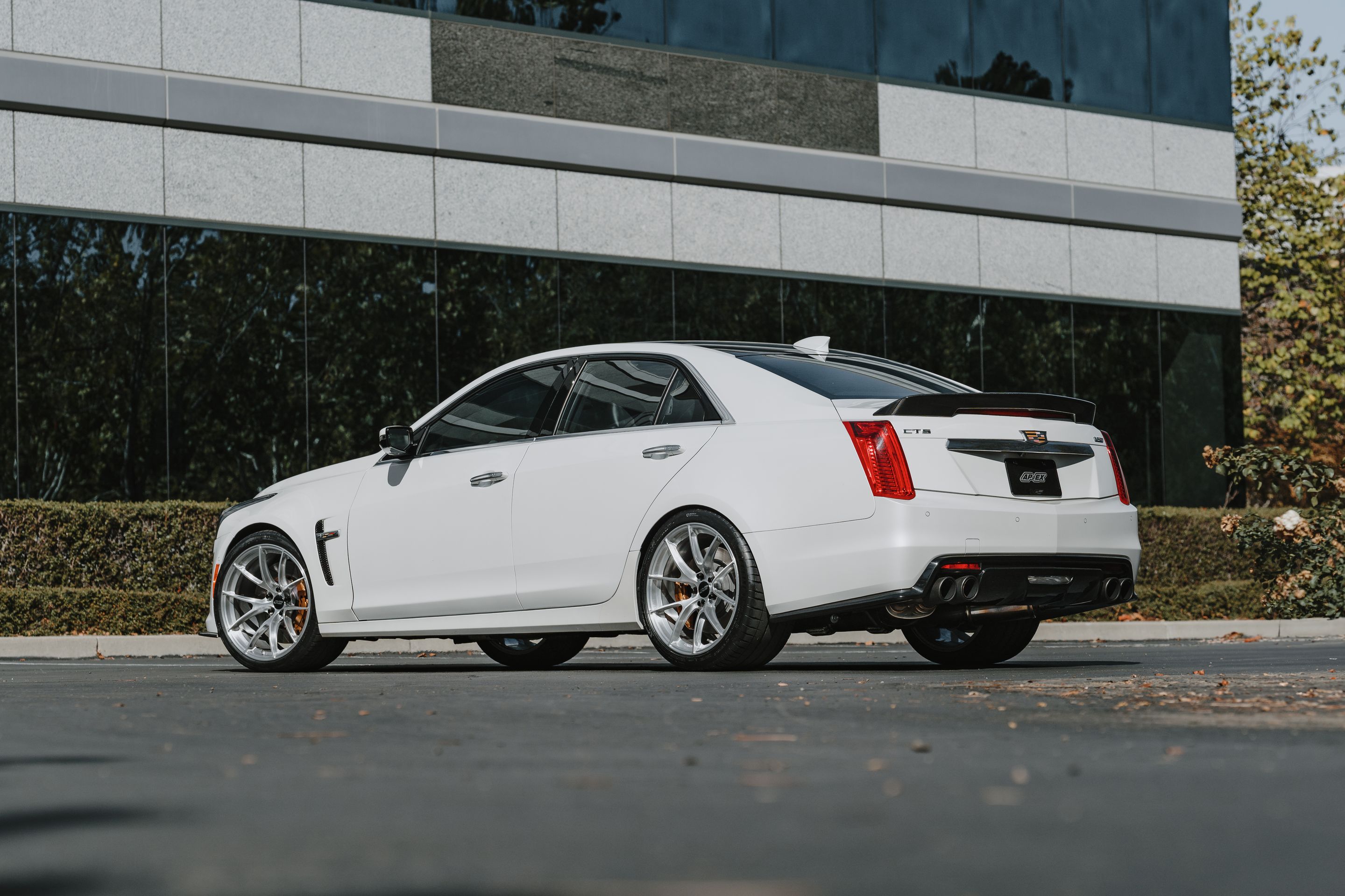 White Cadillac Gen 3 CTS-V with 20" VS-5RS Apex wheels in Brushed Clear