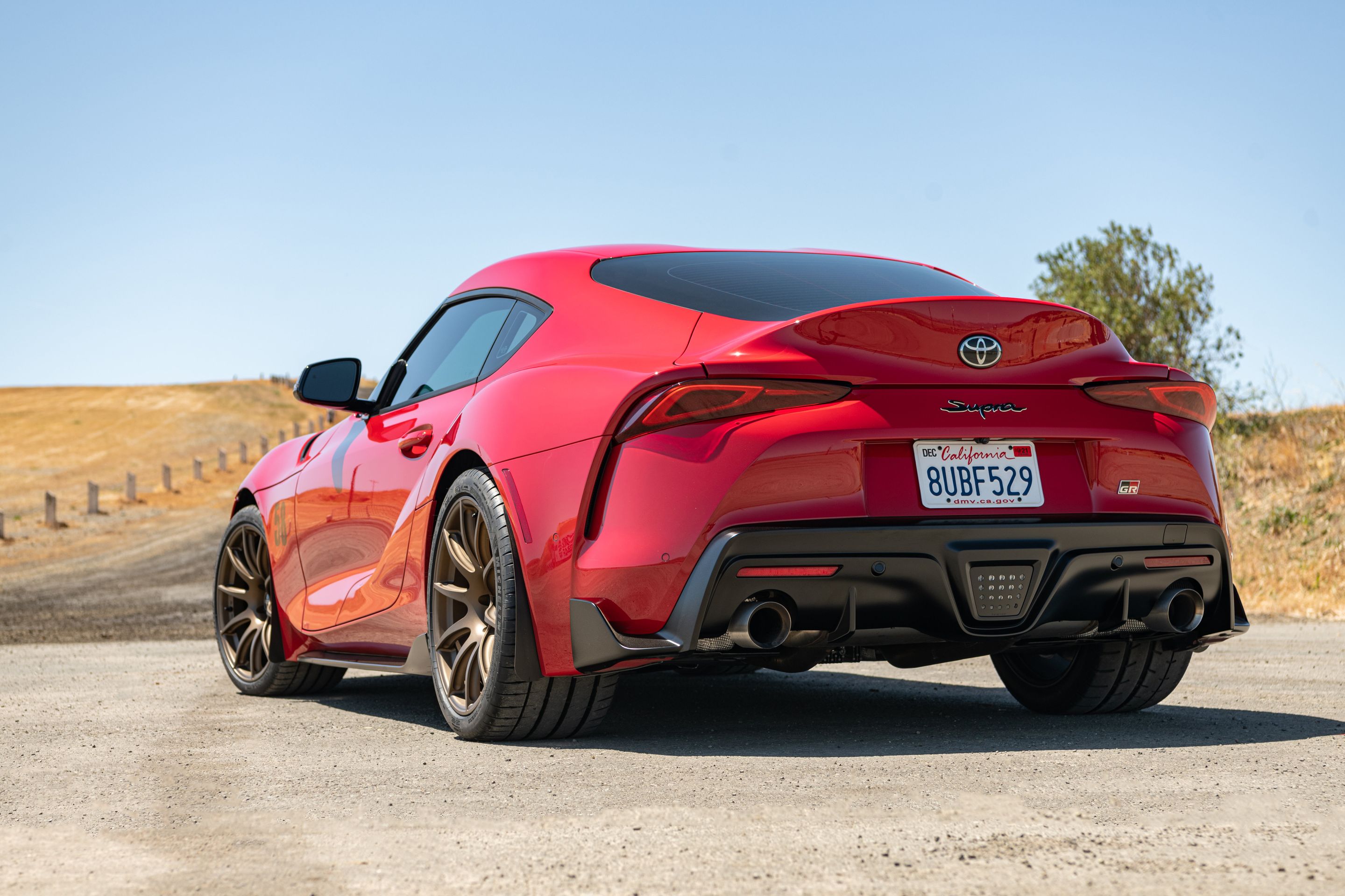 Red Toyota GR Supra with 19" SM-10 Apex wheels in Satin Bronze