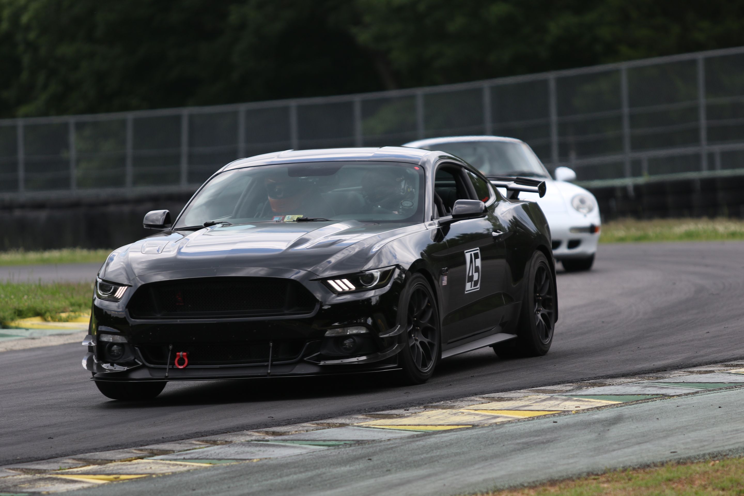 Black Ford S550 Mustang GT with 18" EC-7 Apex wheels in Satin Black