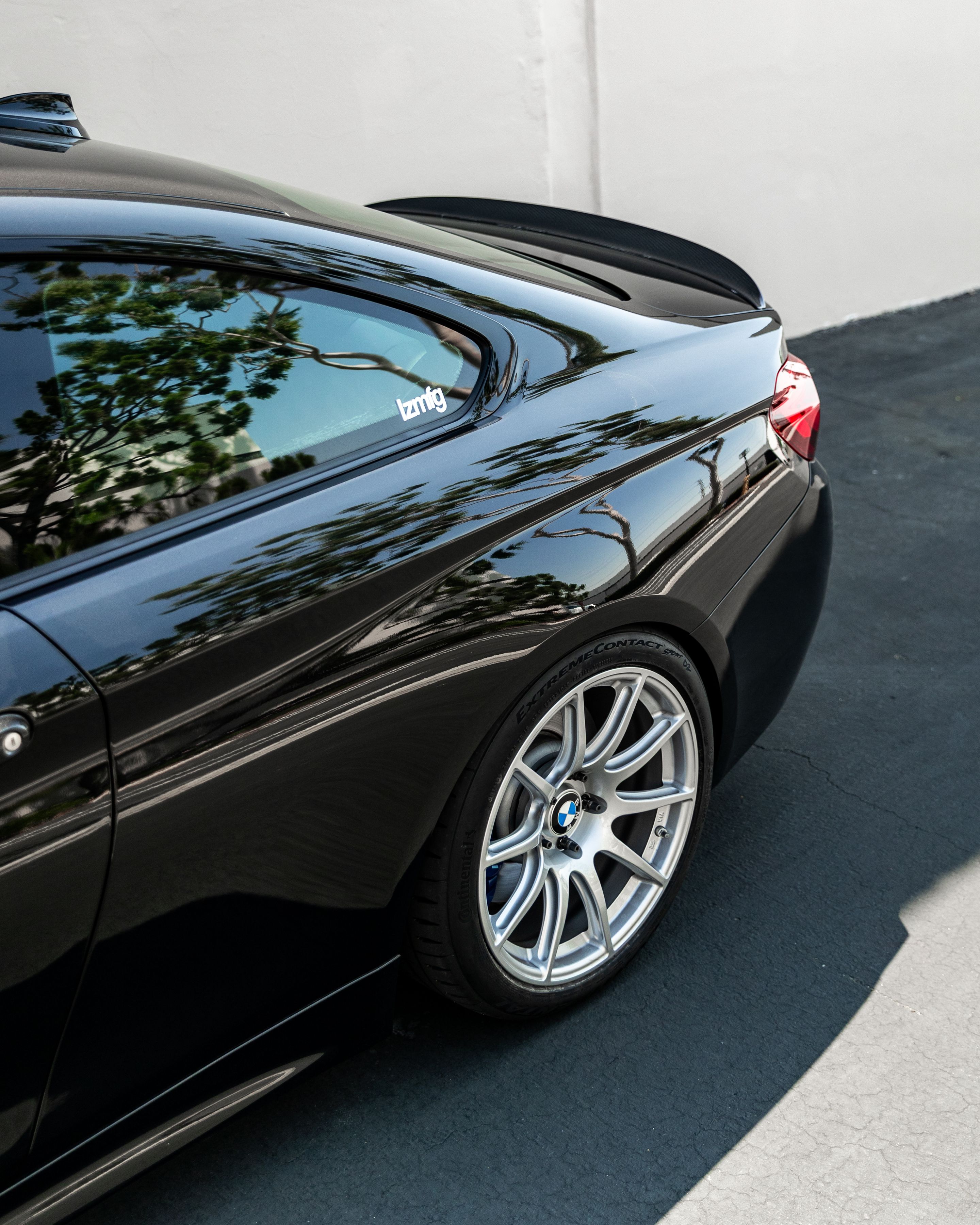 Black BMW F32 Coupe 4 Series with 18" SM-10 Apex wheels in Race Silver