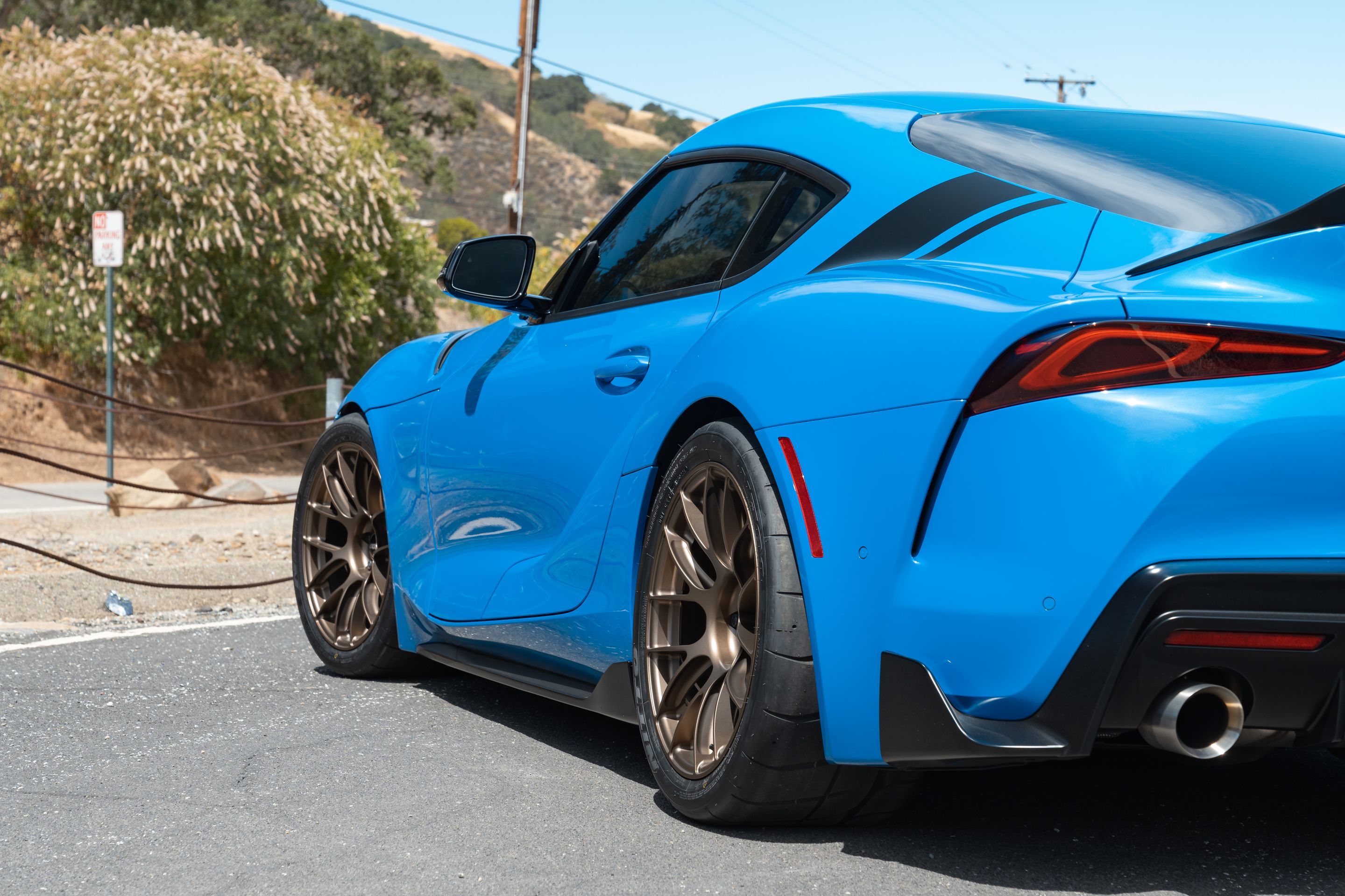 Blue Toyota GR Supra with 18" EC-7RS Apex wheels in Satin Bronze