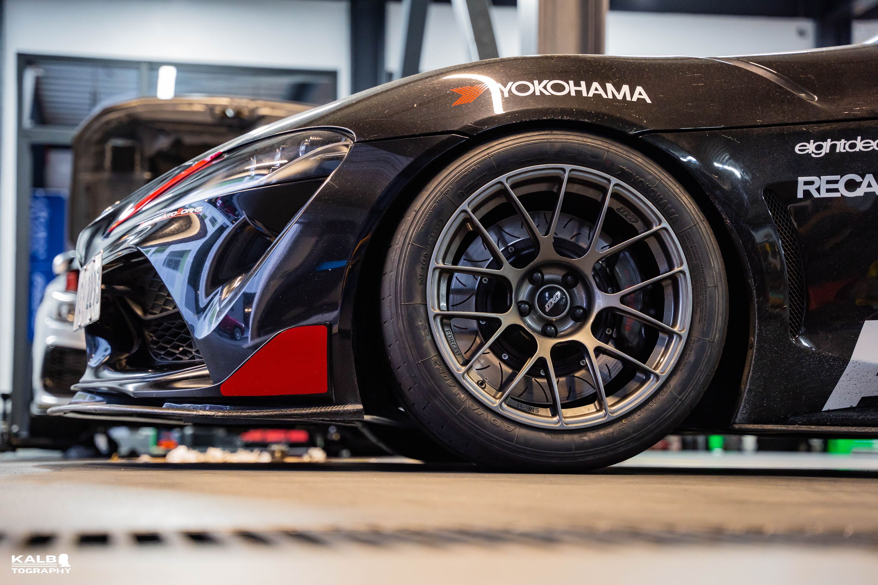 Black Toyota GR Supra with 18" EC-7RS Apex wheels in Satin Bronze