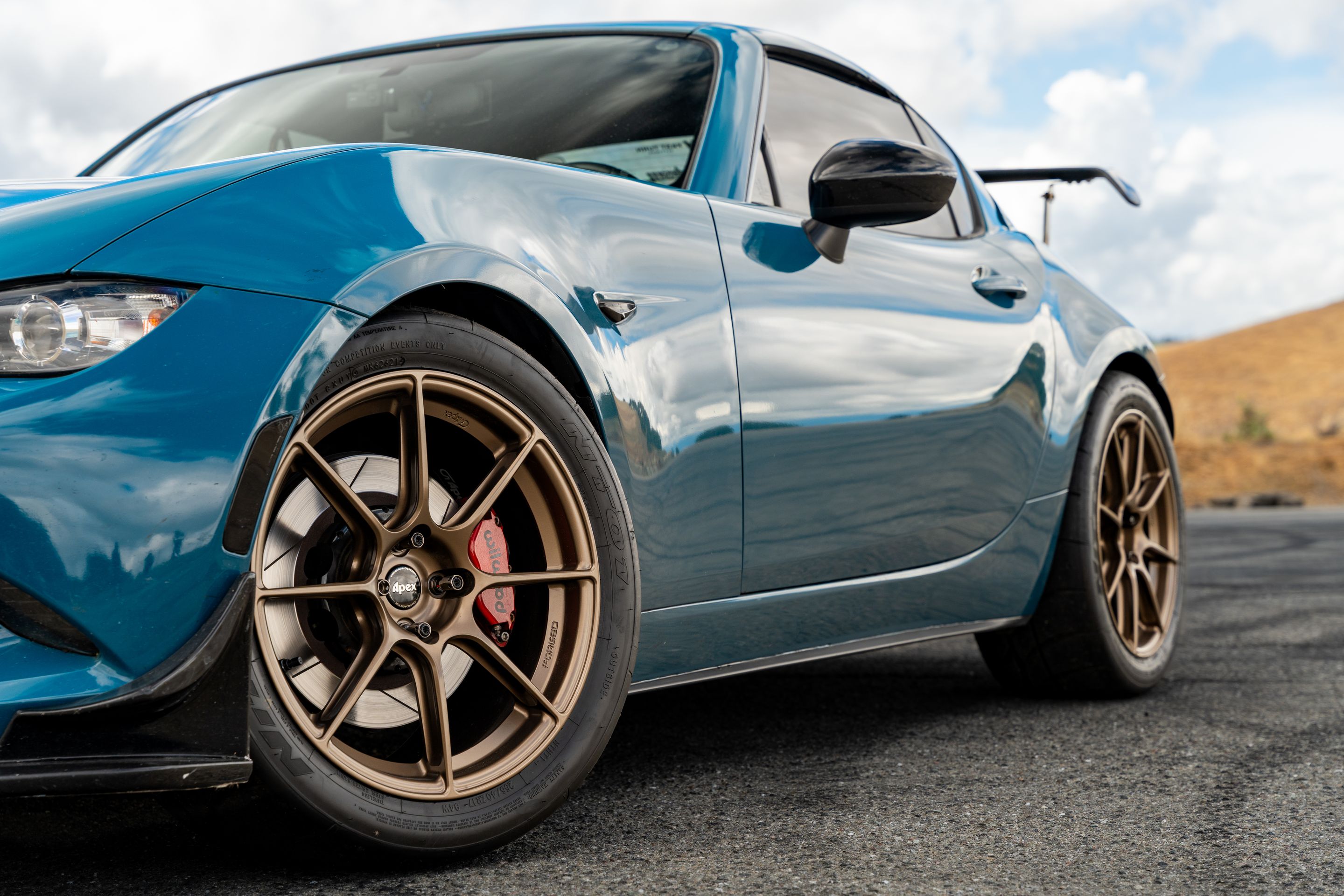 Blue Mazda ND MX-5 Miata with 17" SM-8RS Apex wheels in Satin Bronze